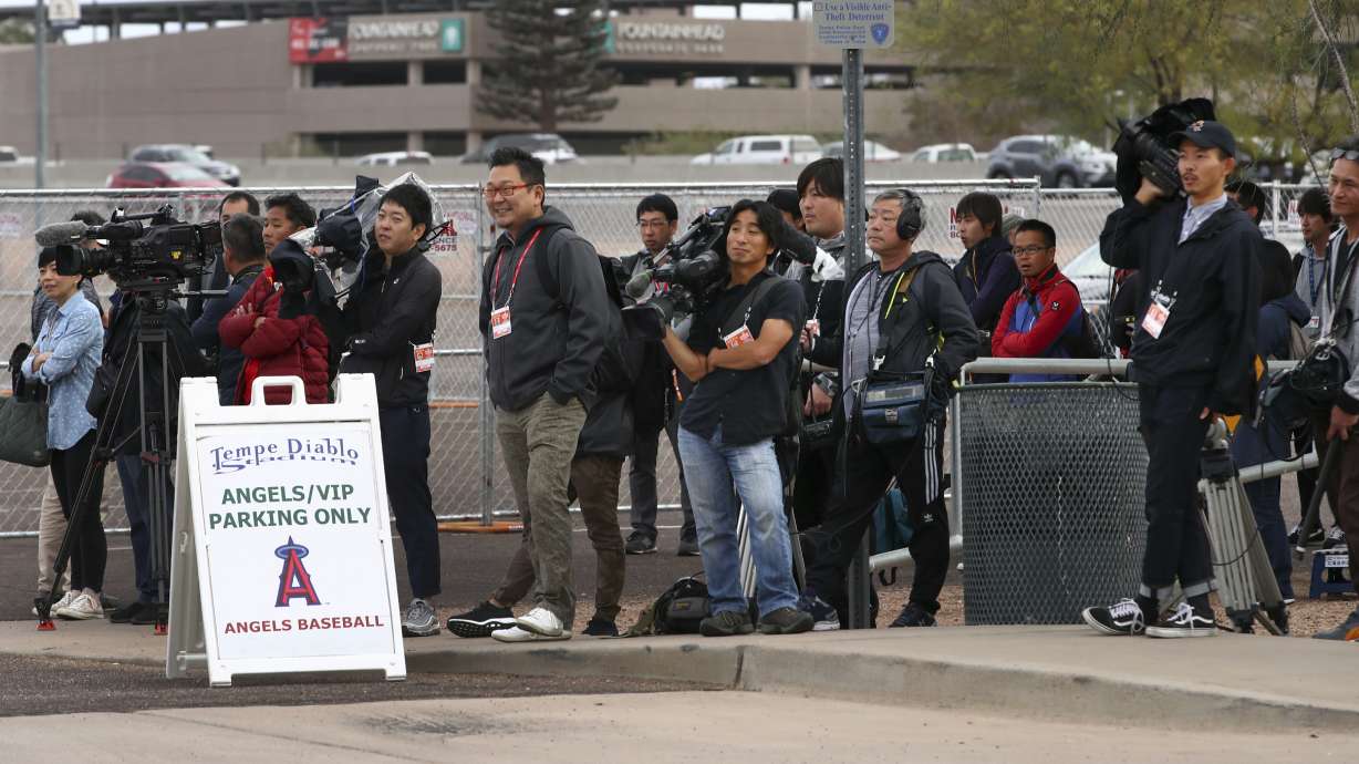 Ohtani reports to Angels with physical, swings and long toss