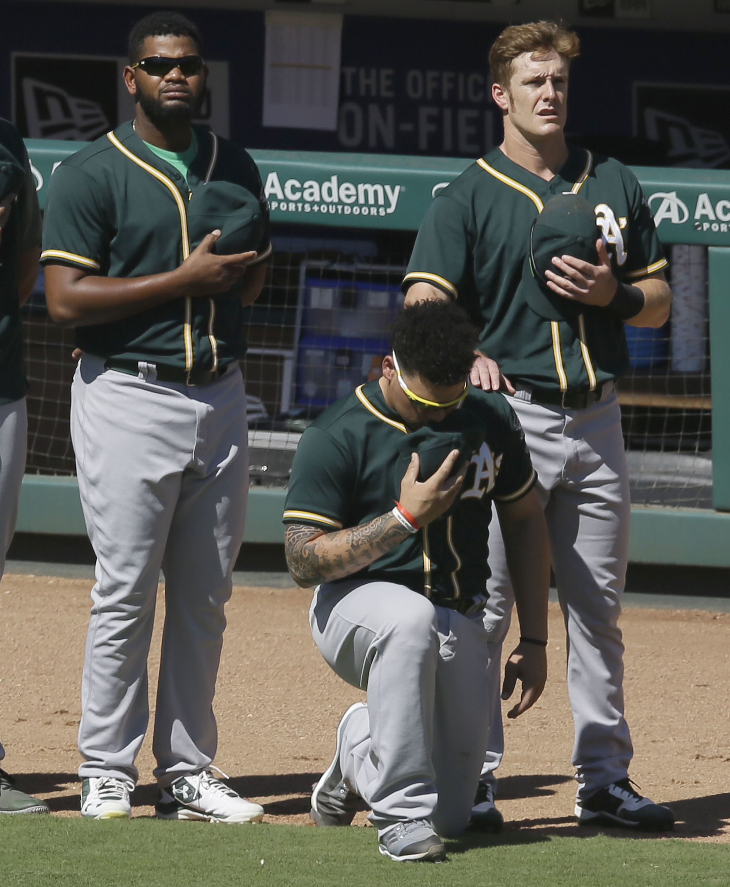 A's catcher Maxwell no longer will kneel for national anthem