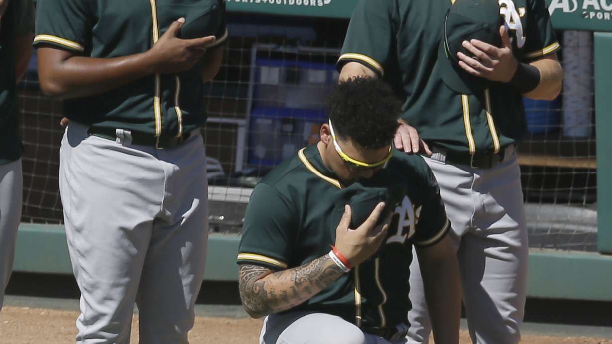 A's catcher Maxwell no longer will kneel for national anthem