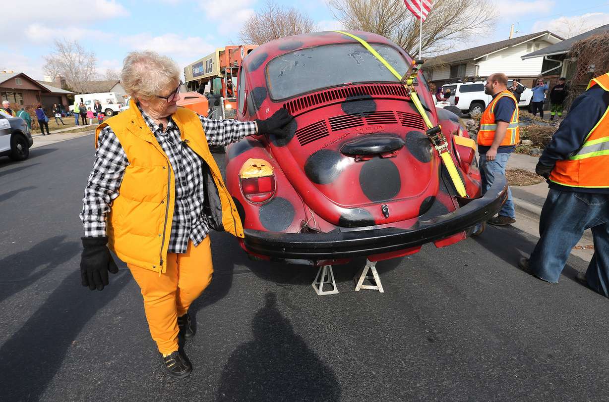 Janis Zettel pats her car, “Lucy,” after it was removed from a tree in her front yard in Clearfield on Tuesday, Feb. 13, 2018. The City Council ruled the Volkswagen Beetle, which is painted to resemble a ladybug, a nuisance. (Photo: Jeffrey D. Allred, KSL)