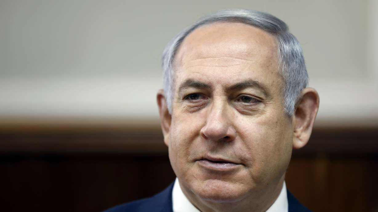 Israeli leader vows to carry on despite corruption charges
