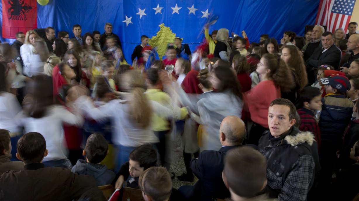 Students celebrate 1st child born in an independent Kosovo