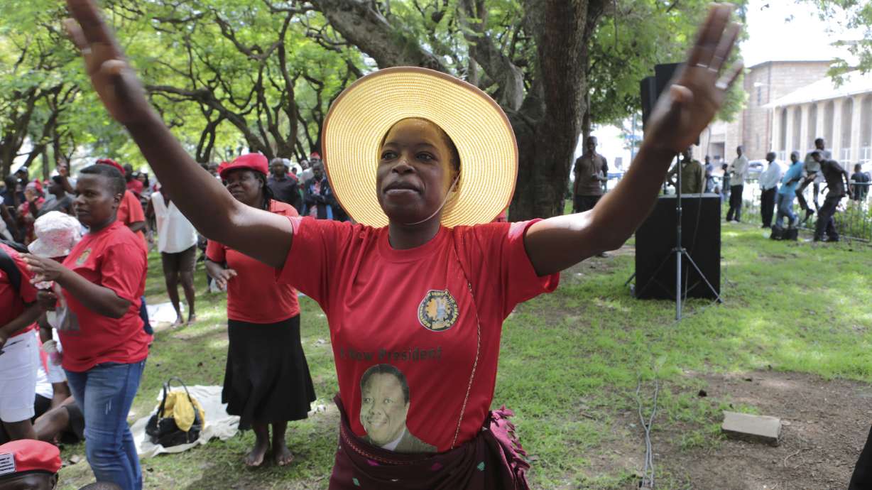 Zimbabwe president sees deceased opposition leader's family