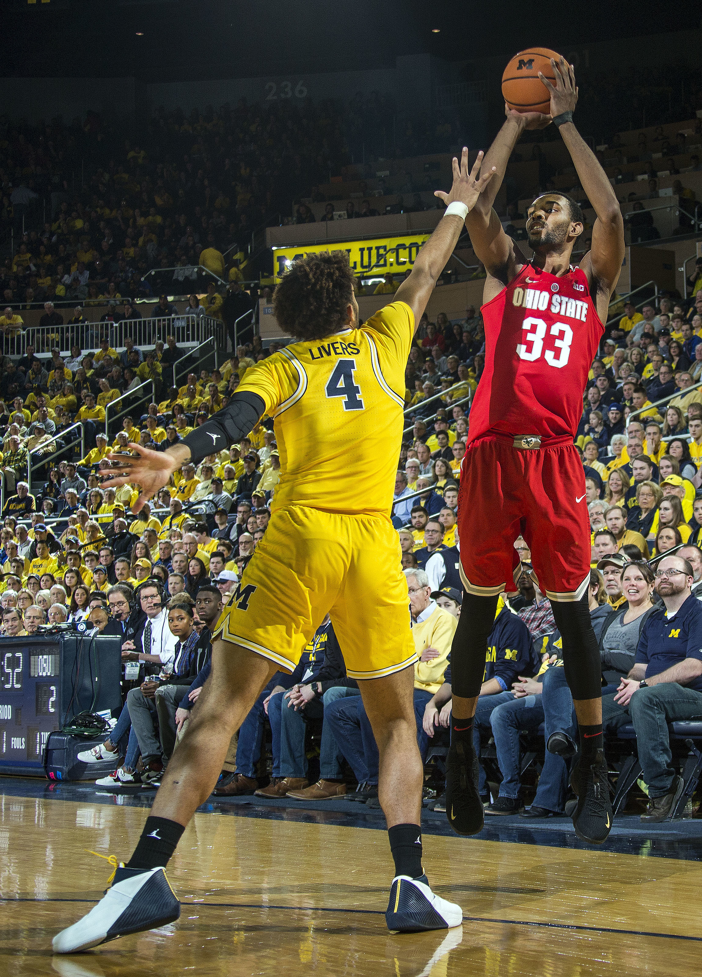 No. 22 Michigan tops No. 8 Ohio St 74-62, helps other rival