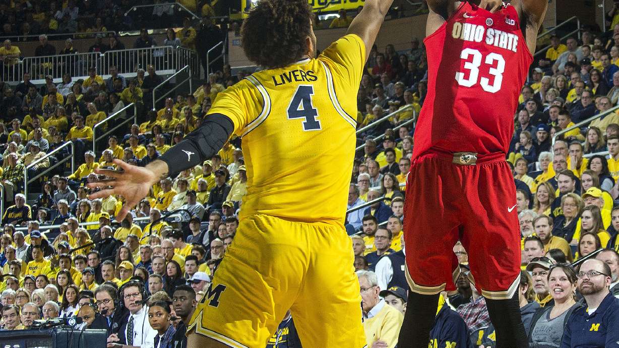 No. 22 Michigan tops No. 8 Ohio St 74-62, helps other rival
