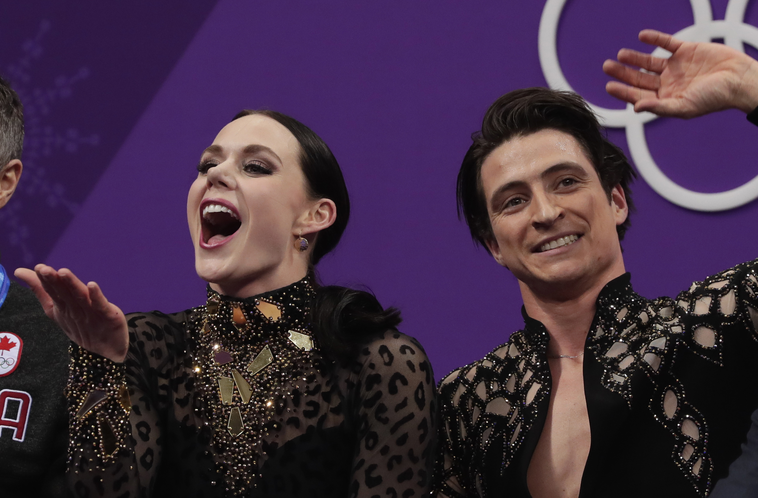 Virtue, Moir lead ice dancing after record short dance