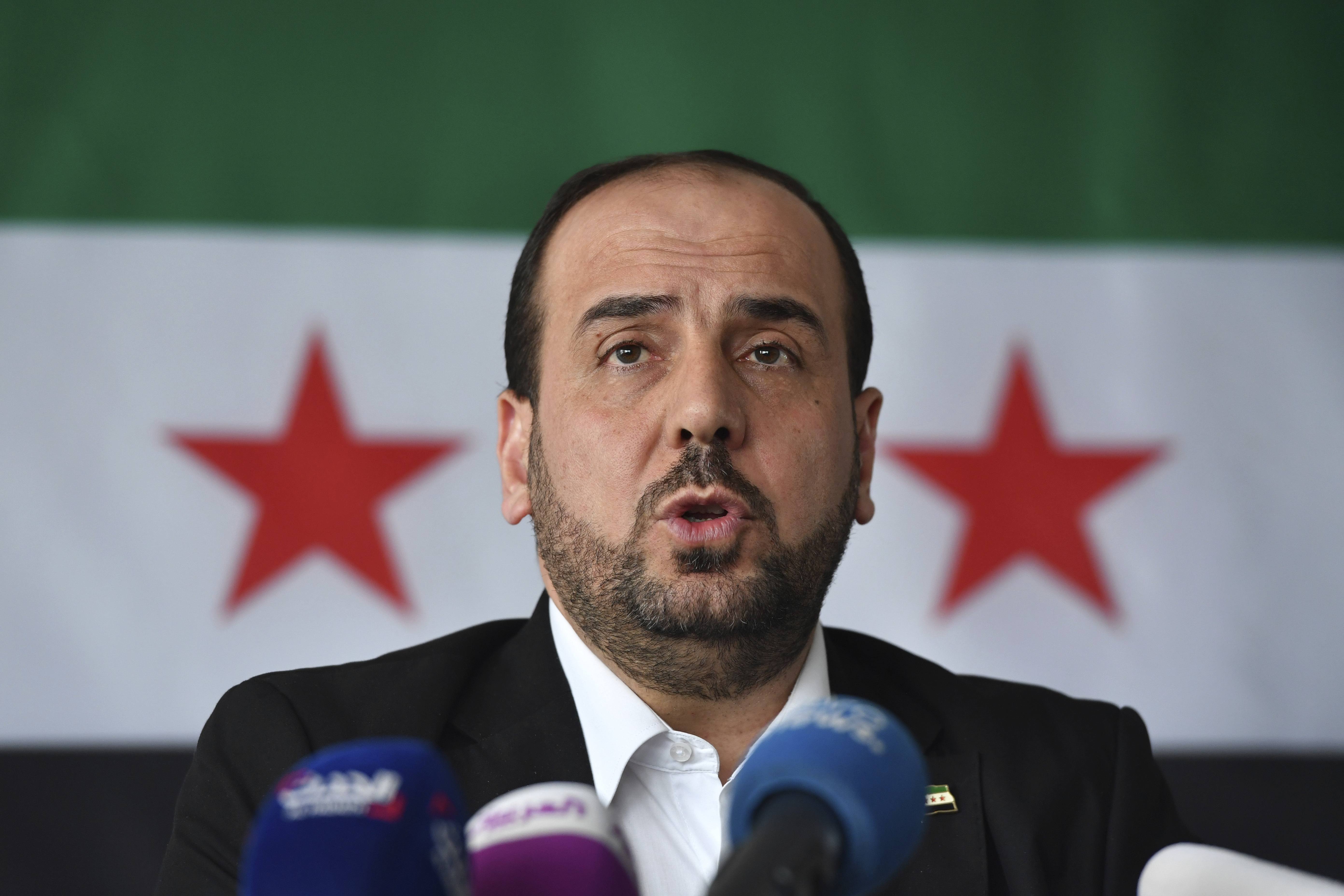 AP Explains: Syria's starved, rebellious suburb under attack