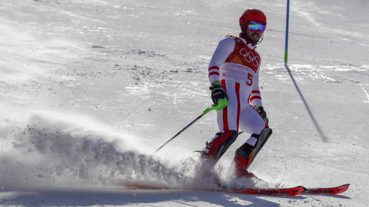 Myhrer wins Olympic slalom at 35 as favorites ski out