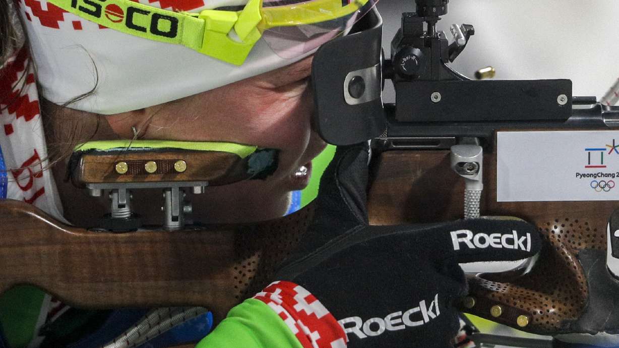 Domracheva, Belarus handle heavy winds to win biathlon relay