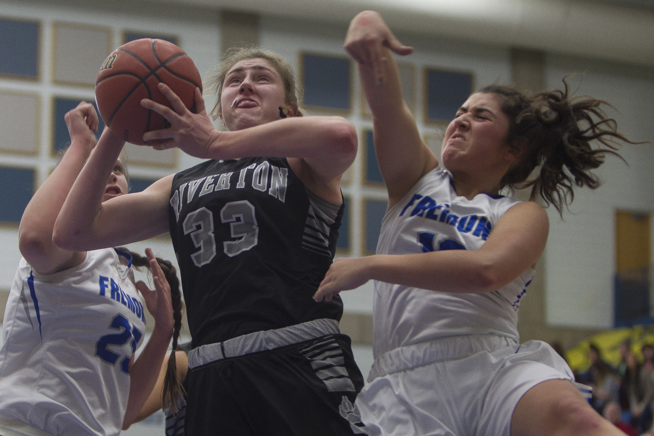 Riverton's Morgan Kane puts up a shot while guarded by Fremont's Emma Calvert, left, and Abby Broadbent during Fremont's 48-46 win over Riverton in the Class 6A state quarterfinals at Salt Lake Community College in Taylorsville on Thursday, Feb. 22, 2018. (Photo: Jacob Wiegand, Deseret News)