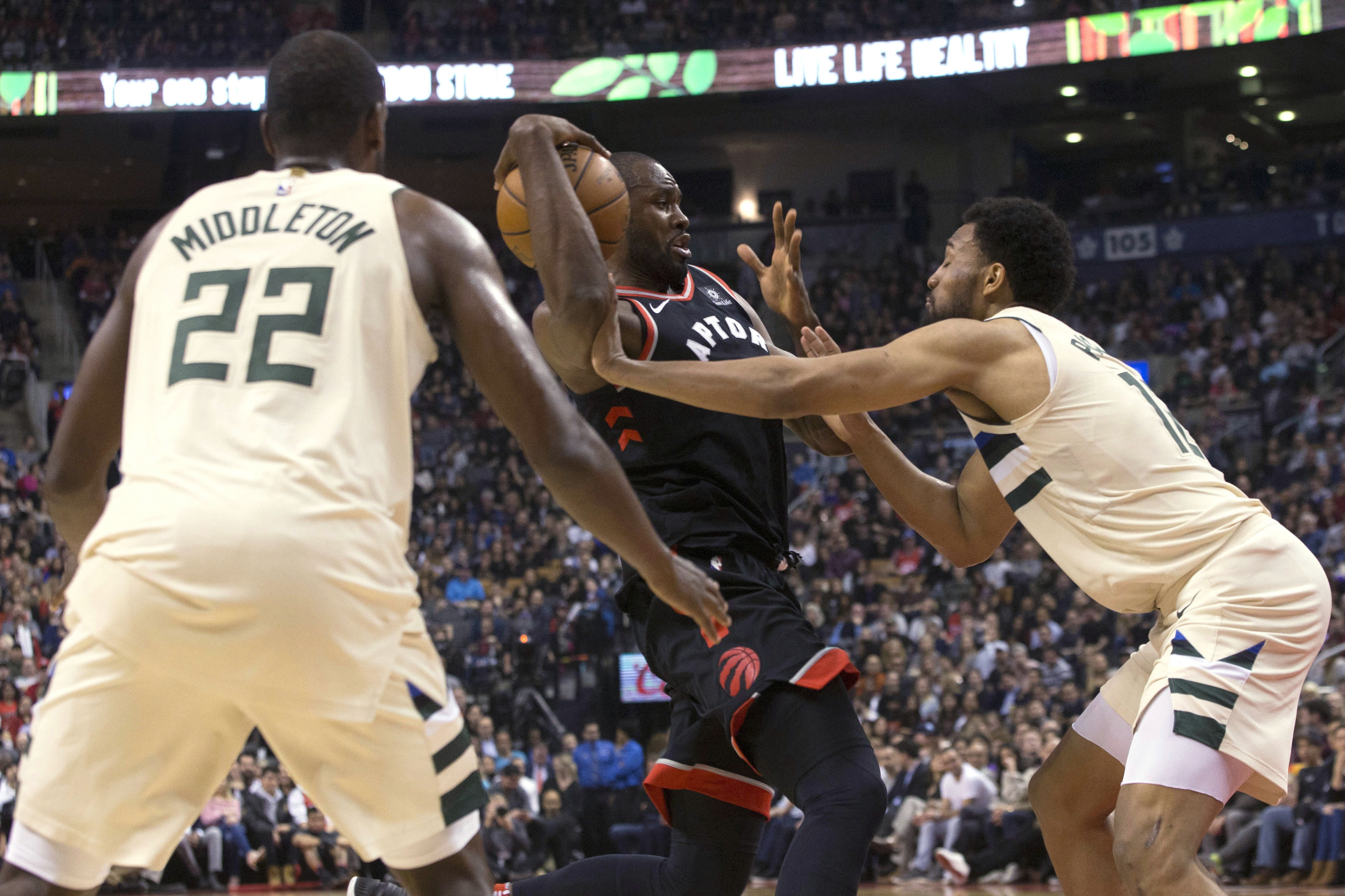 Antetokounmpo scores 26, Bucks beat Raptors 122-119 in OT