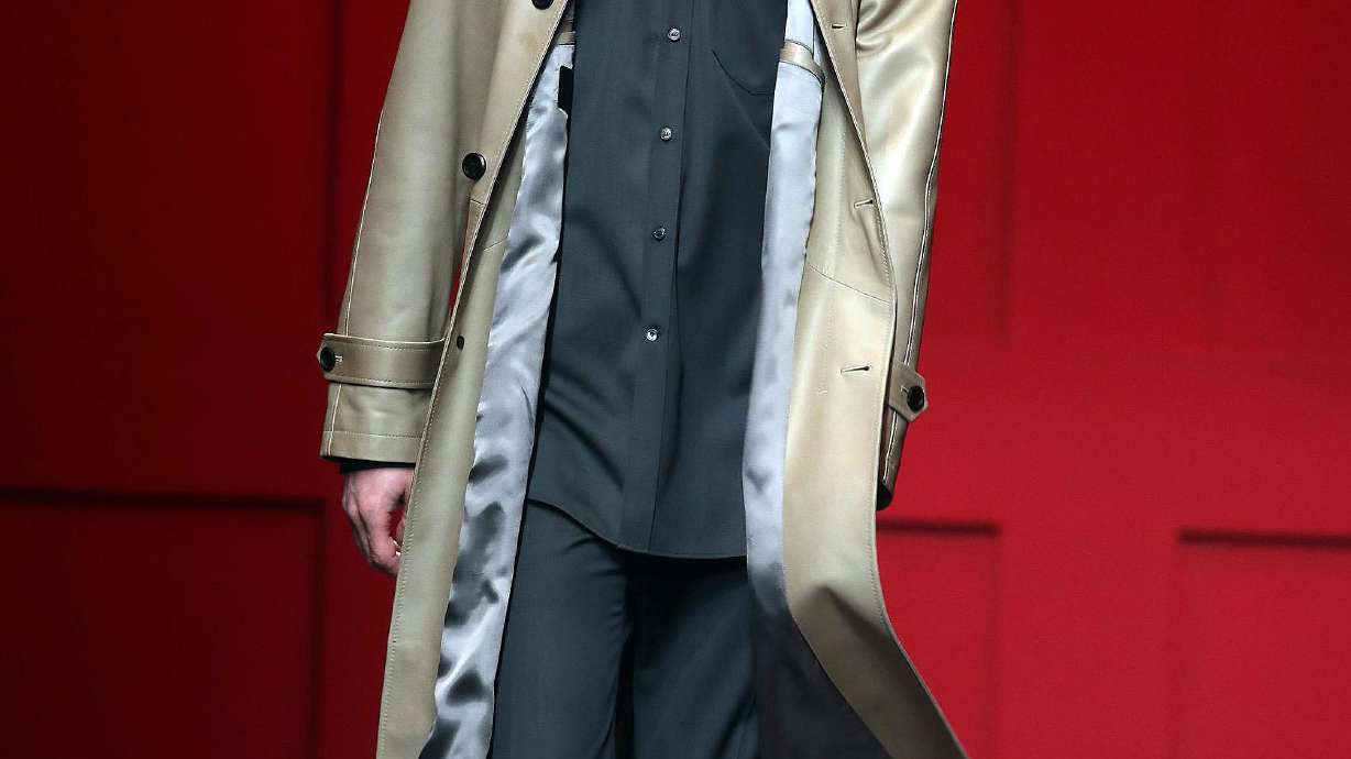 Armani rejects overdone emotion, Ferragamo favors color