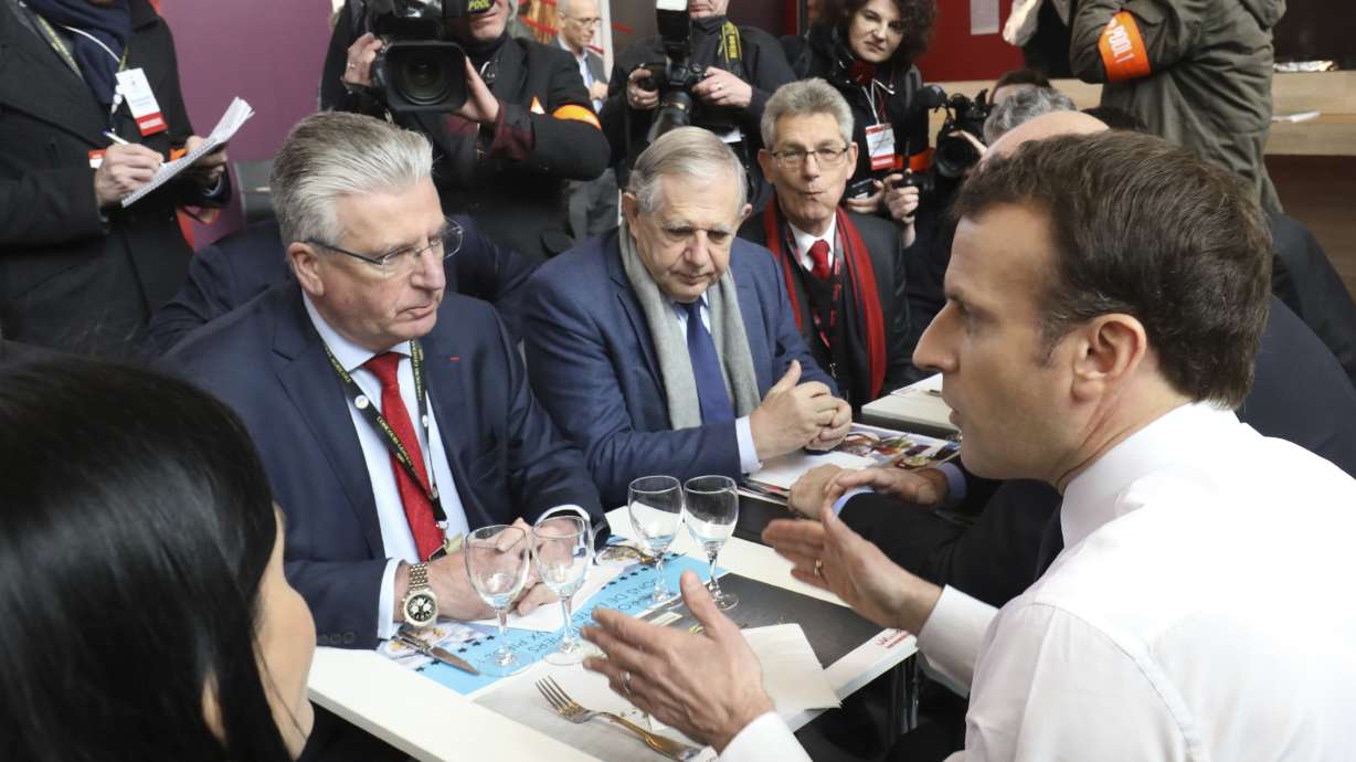 Angry French farmers boo President Macron at Paris ag fair