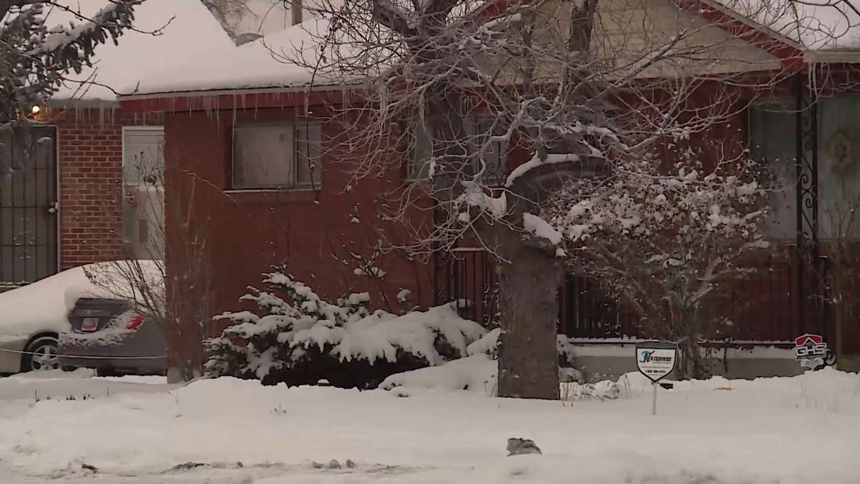 A man was arrested after police said he barricaded himself inside a home and took a 99-year-old woman hostage. (Photo: KSL TV)
