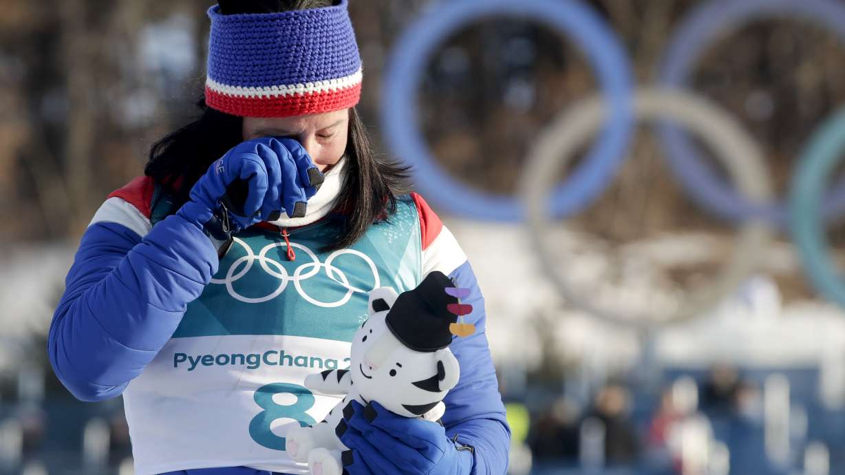 Russian men win hockey; Bjoergen, Norway get gold again