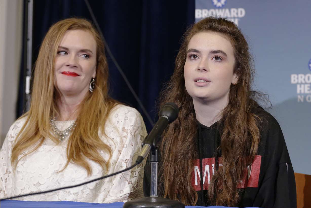 Marjory Stoneman Douglas High School shooting survivor Maddy Wilford, right, speaks to the media as her mom Missy looks on during a press conference at Broward Health North in Deerfield Beach, Fla., Monday, Feb. 26, 2018. (Terry Renna, AP Photo)