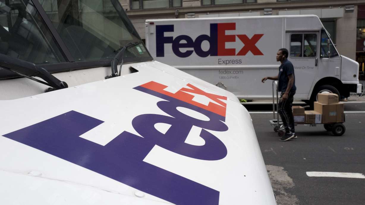 The Latest: FedEx bucks corporate trend, sticks with NRA