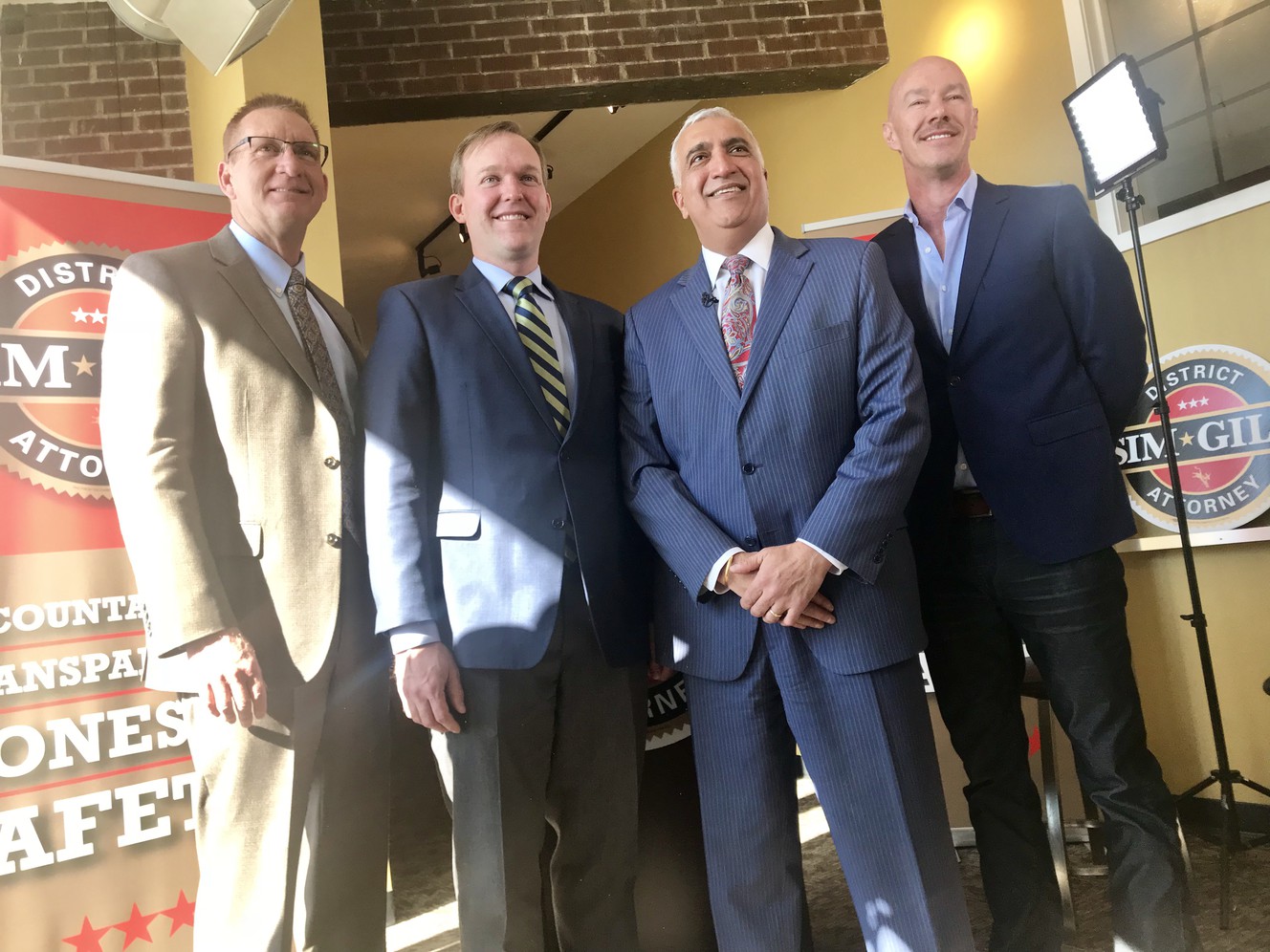 Moab Police Chief Jim Winder, left, Salt Lake County Mayor Ben McAdams, Salt Lake County District Attorney Sim Gill and former Salt Lake City Police Chief Chris Burbank pose for a photo after Gill announced that he would seek a third term during a press conference in Salt Lake City on Wednesday, Feb. 28, 2018. (Photo: Pat Reavy, KSL)