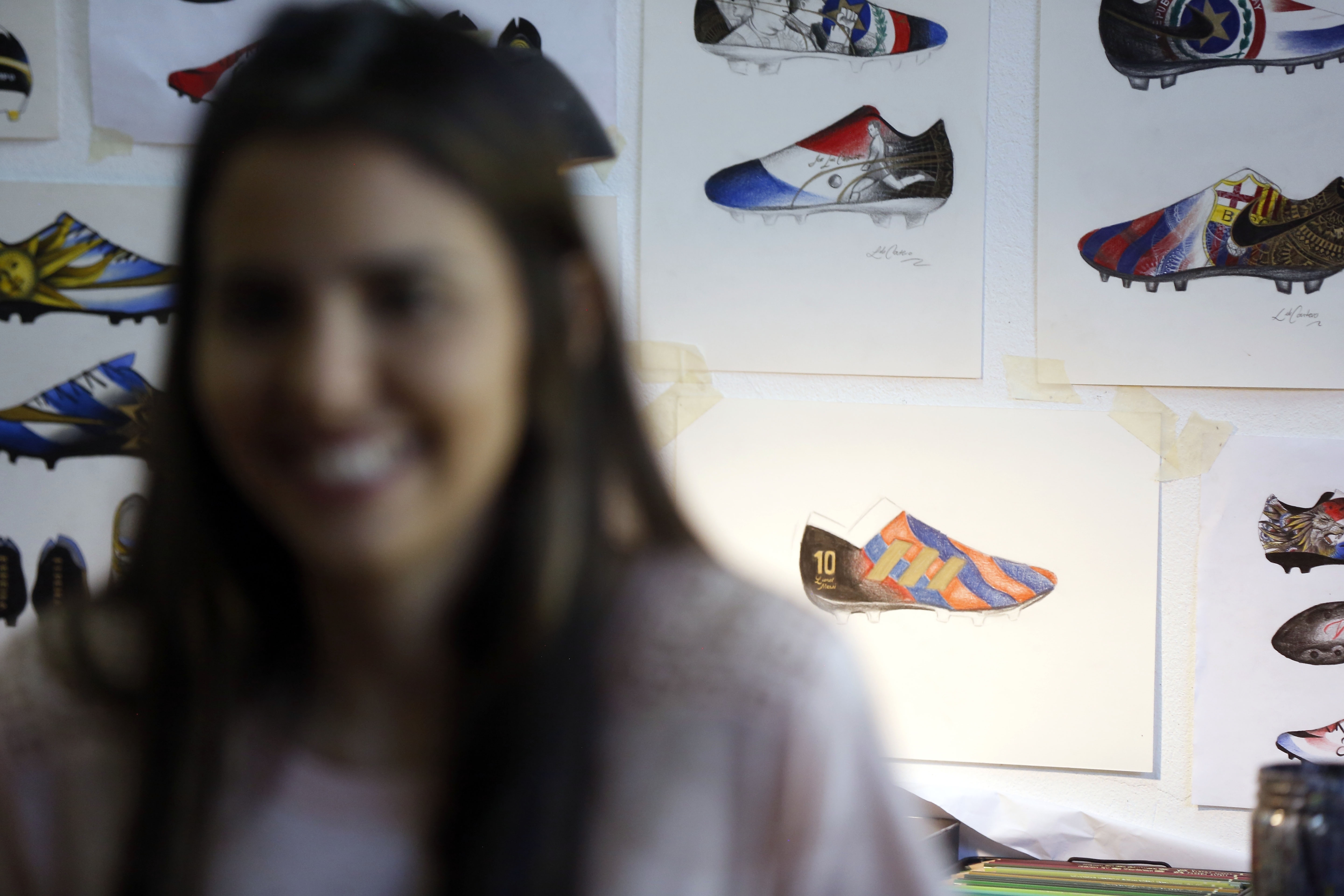 Messi's life painted on soccer boots by Paraguayan artist