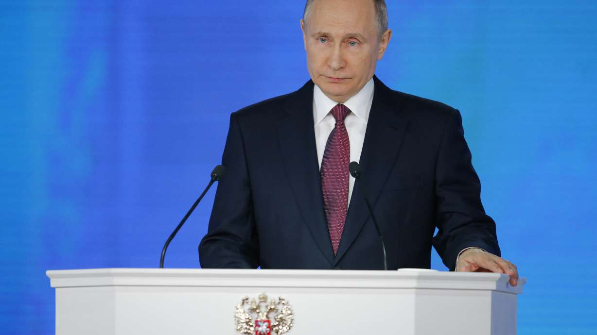 Putin boasts of new weapons, vows to boost living standards