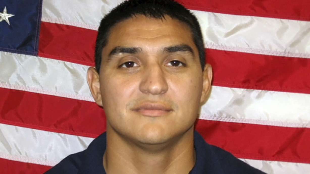 Officials say marshal slain on duty was hit by friendly fire