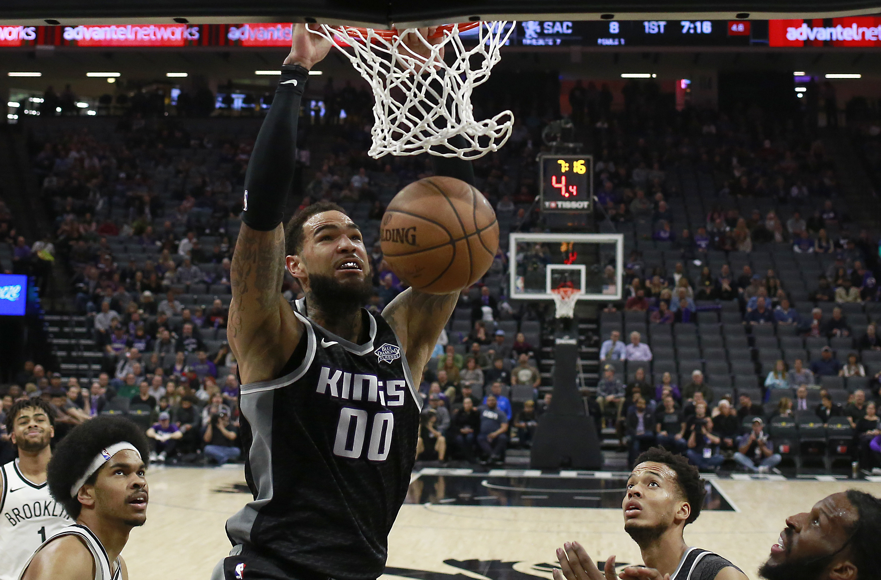 Kings outlast Nets 116-111 in overtime