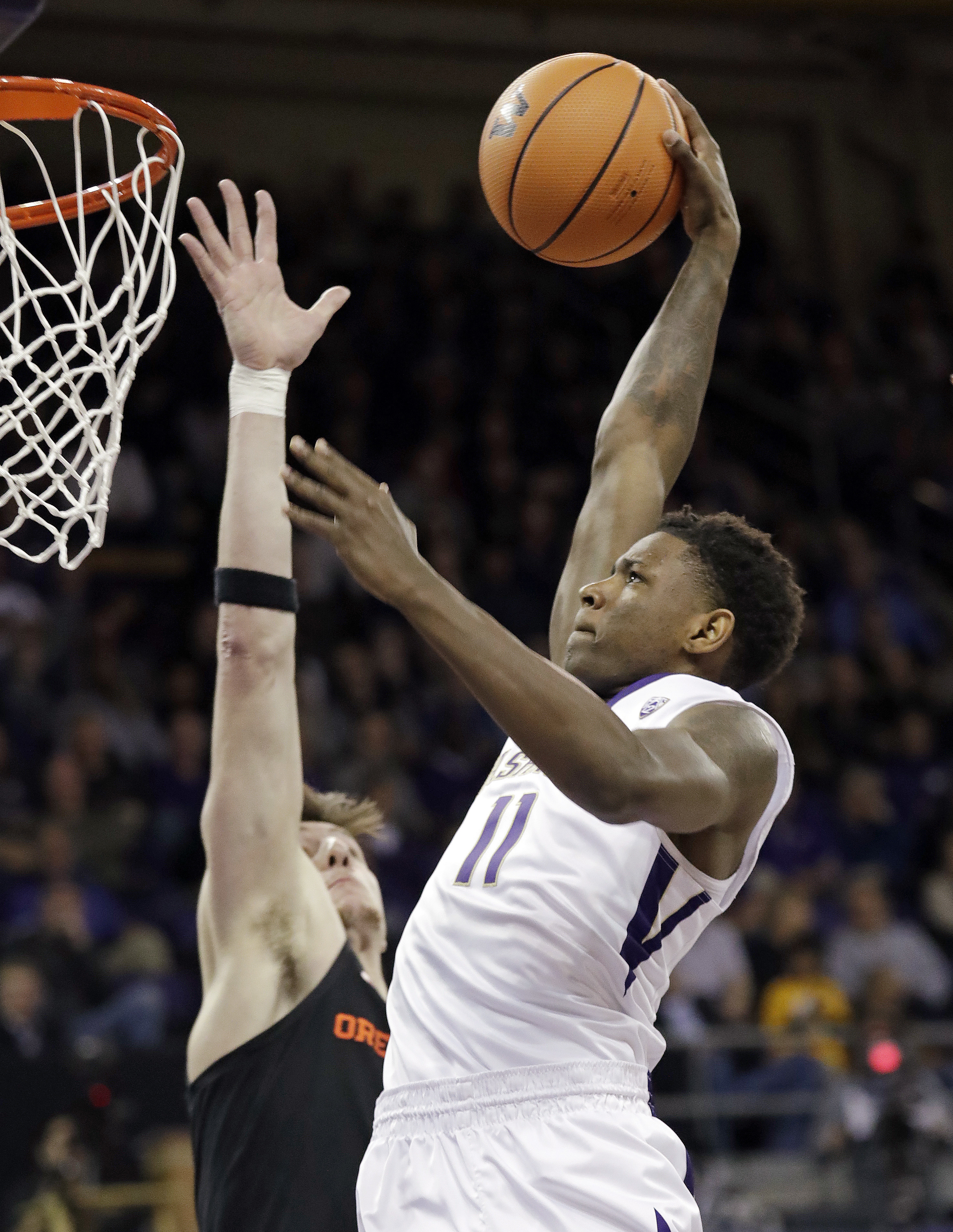 Dickerson helps Washington edge Oregon State 79-77
