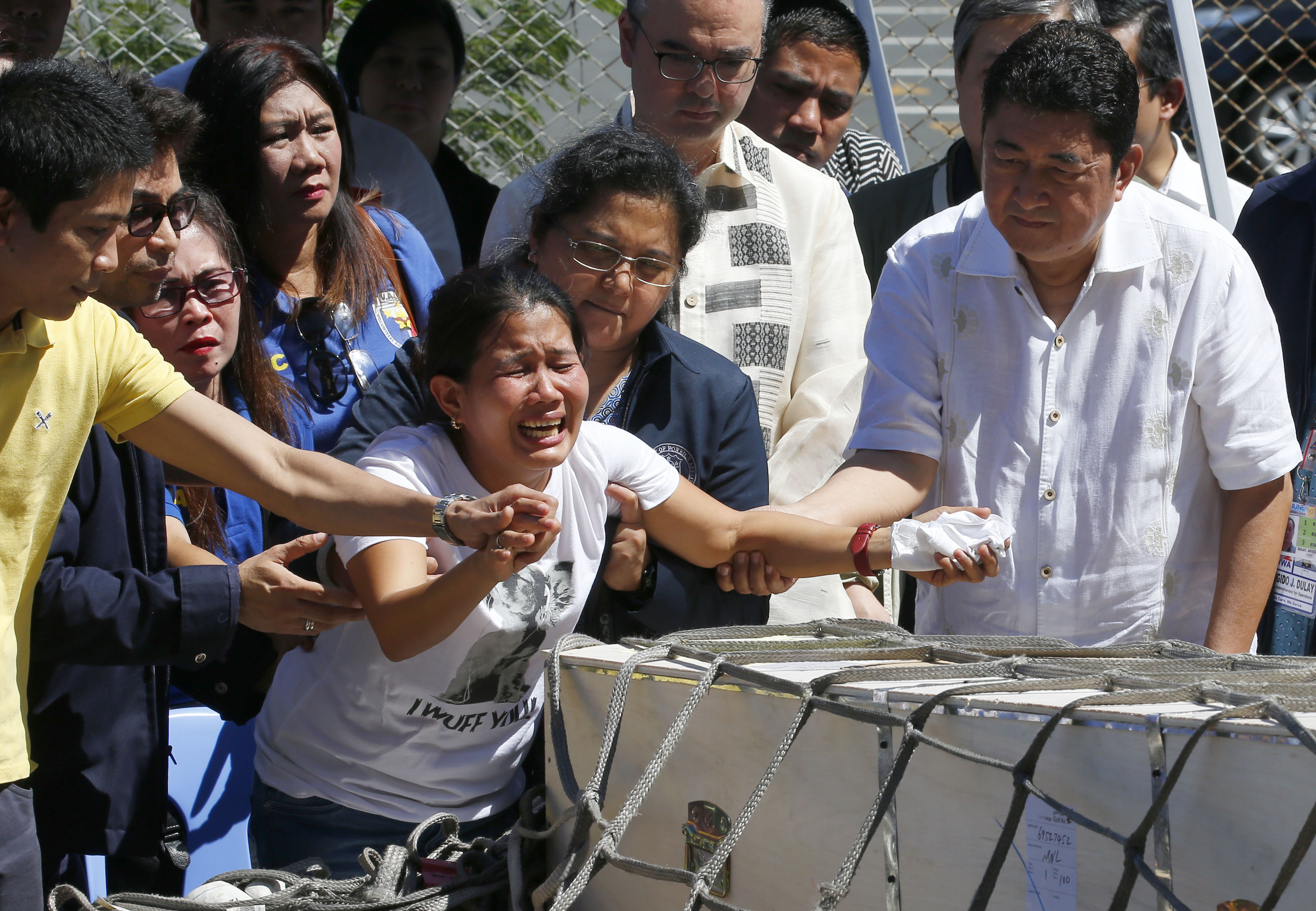 Slain Filipina in freezer shows risks to overseas workers