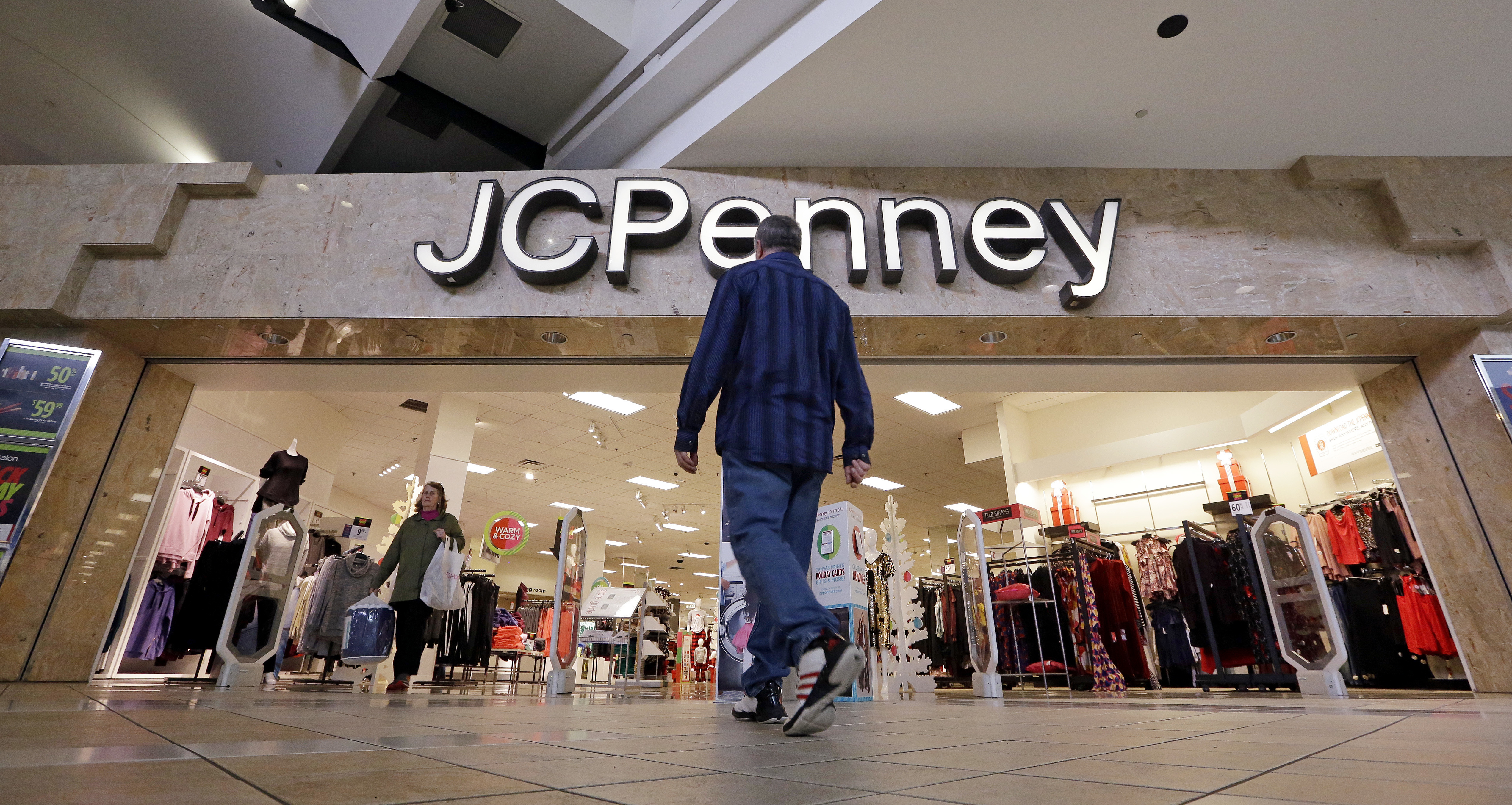 J.C. Penney says it has cut jobs, offers muted outlook