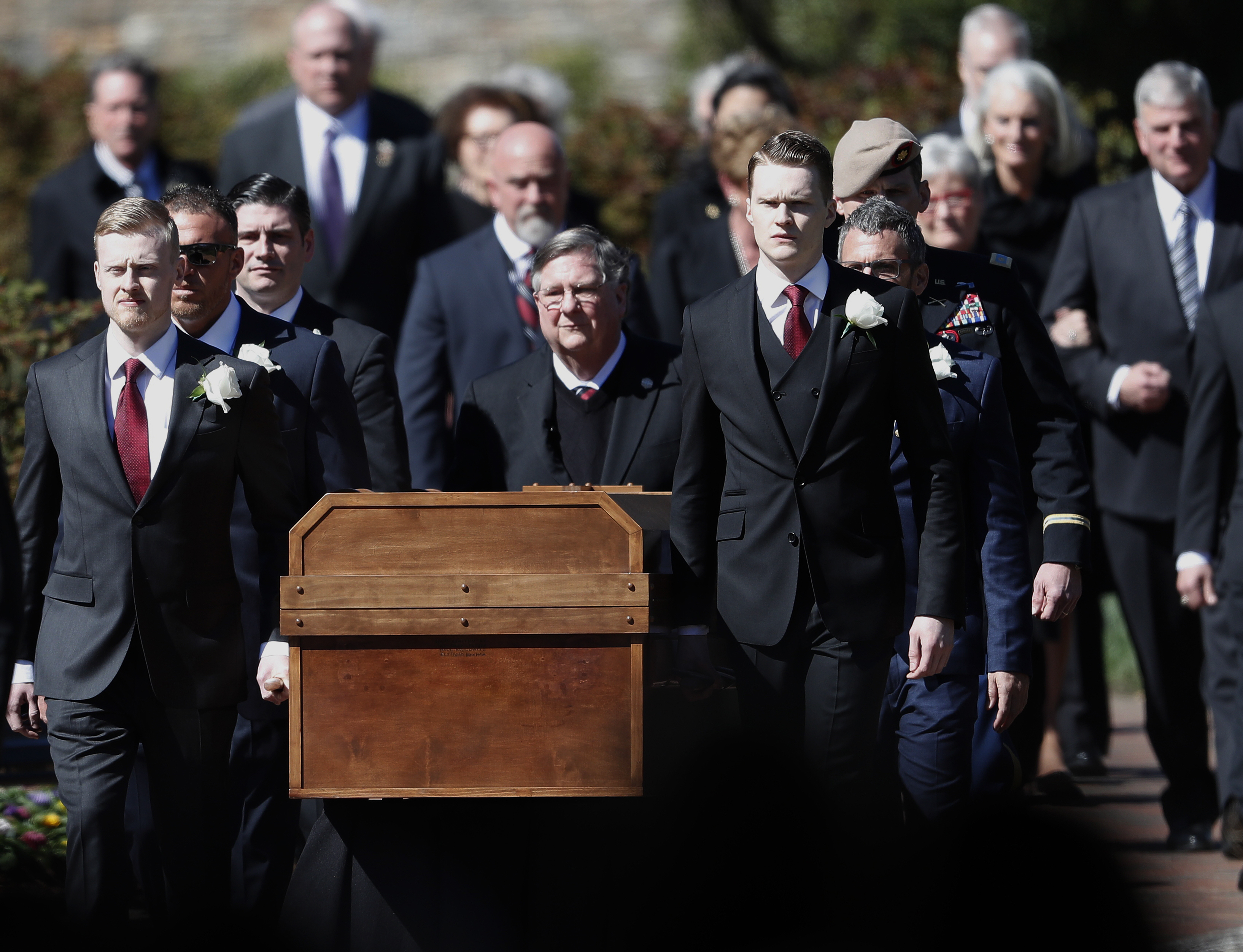 The casket of The Rev. Billy Graham is moved during a funeral service at the Billy Graham Library for the Rev. Billy Graham, who died last week at age 99, Friday, March 2, 2018, in Charlotte, N.C. (AP Photo/John Bazemore)