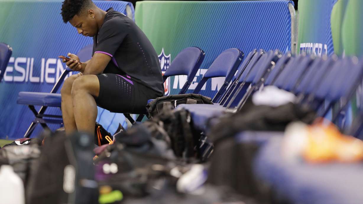 Last 2 Heisman winners face scrutiny over NFL futures