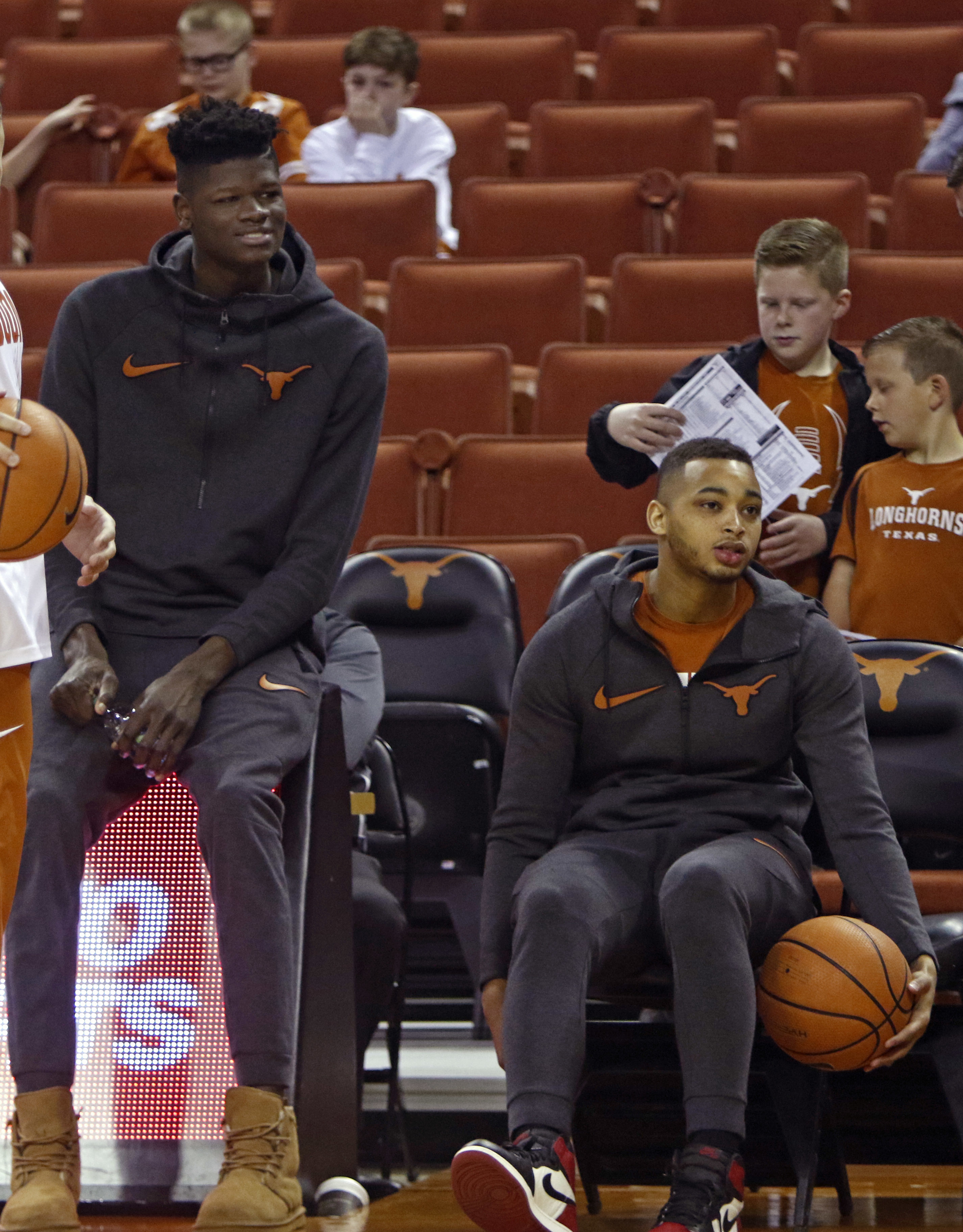 Desperate Texas tops No. 20 West Virginia 87-79 in OT