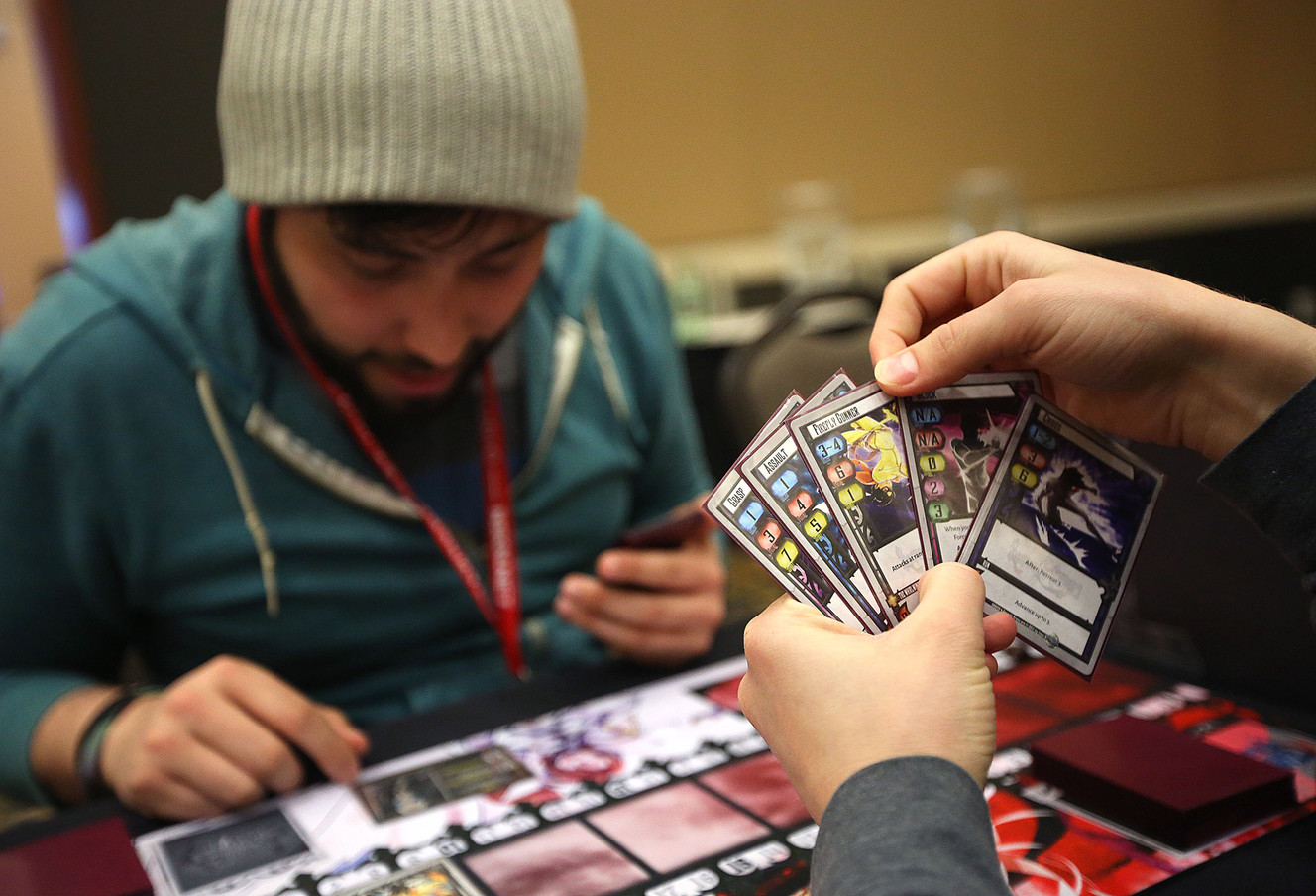 Alex Hurley, left, plays Exceed Fighting System with Alex Friedland at the SaltCON Board Game Convention at the Davis Conference Center in Layton on Thursday, March 1, 2018. (Photo: Kristin Murphy, KSL)