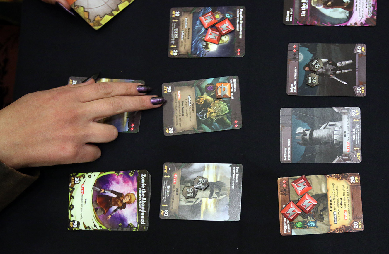 Jessica Solis plays Temporal Odyssey at the SaltCON Board Game Convention at the Davis Conference Center in Layton on Thursday, March 1, 2018. (Photo: Kristin Murphy, KSL)