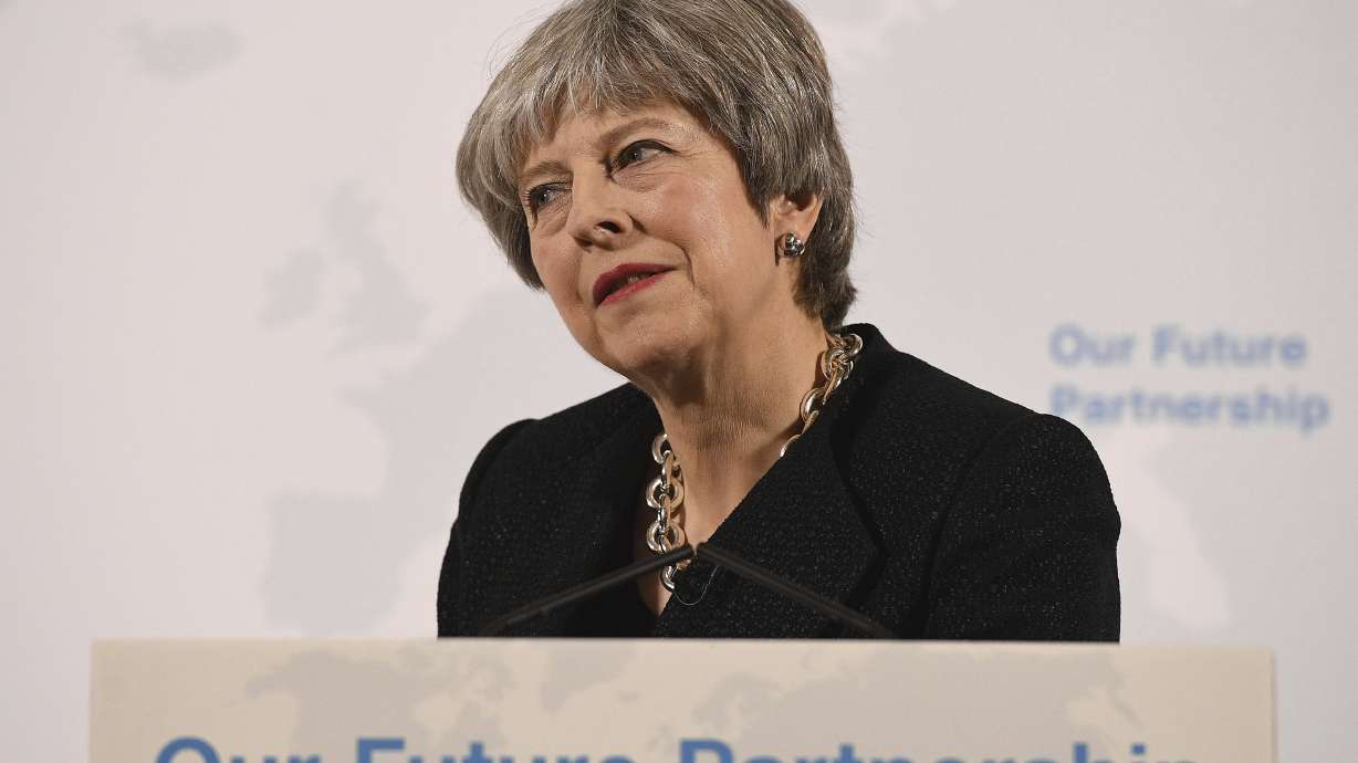 UK leader tries to ease concerns of banks in Brexit talks