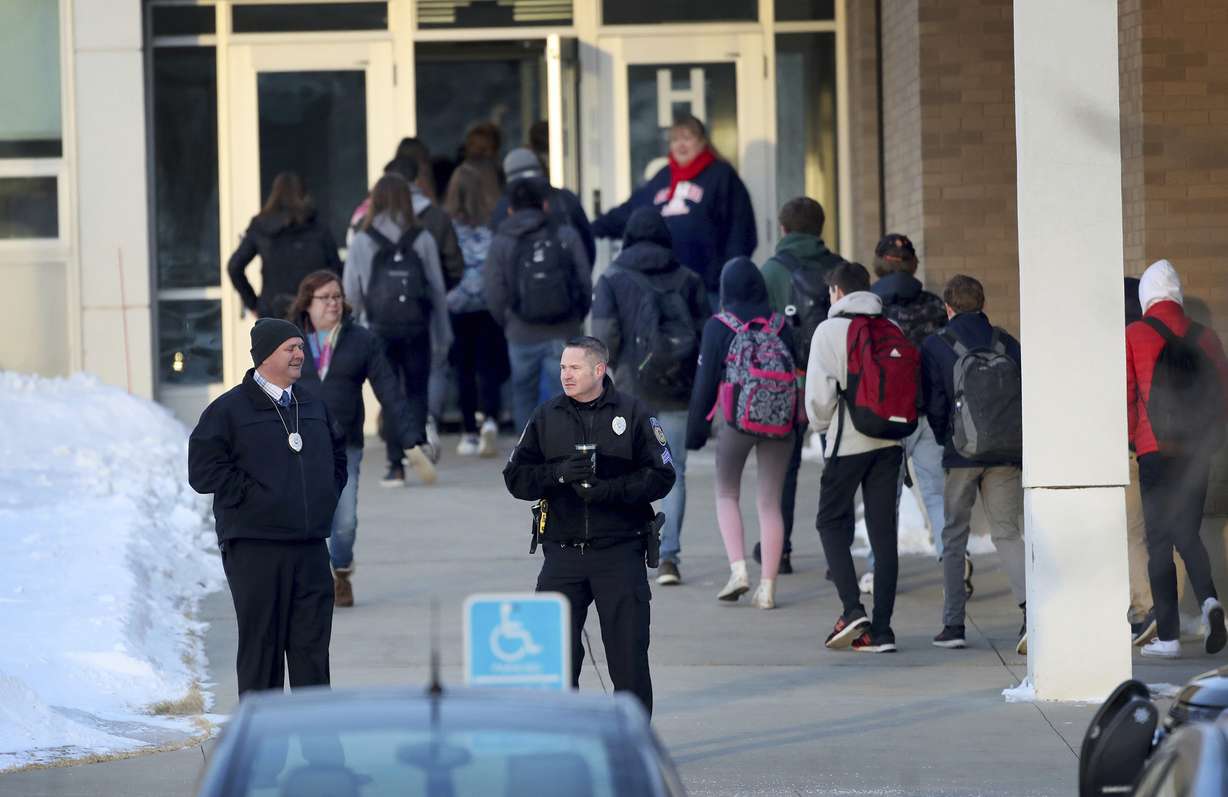 In this Feb. 22, 2018 photo, police officers stand guard as Orono High School students arrive for school, one day after a threat was posted, causing the school to go on lockdown in Orono, Minn. An autistic Orono High School student whose alleged threat led to a six-hour lockdown is in juvenile court. He’s received an outpouring of sympathy, and donations for his family. The Feb. 14 killings of 17 people in Parkland, Fla., ignited the usual copycat threats. (Photo: David Joles/Star Tribune, via AP)
