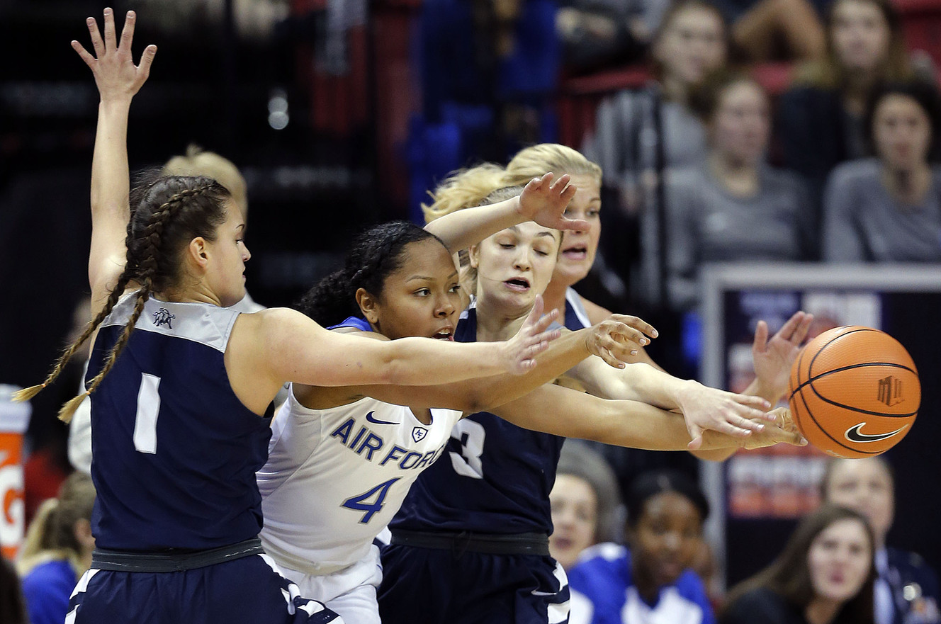 Utah State Aggies guard Eliza West, left, guard Olivia West and forward Hailey Bassett defend Air Force Falcons guard Alexis Springfield during the Mountain West Conference basketball tournament in Las Vegas on Monday, March 5, 2018. (Photo: Ravell Call, Deseret News)
