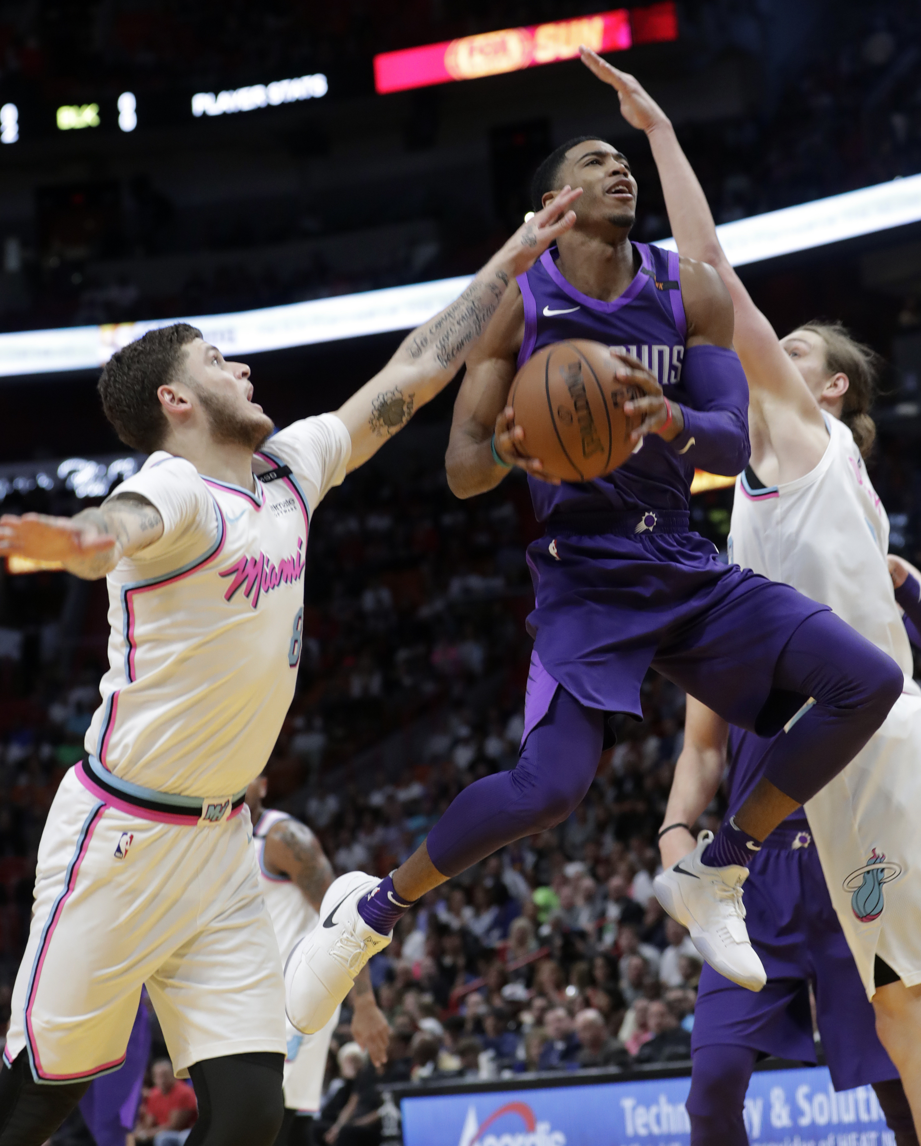 Whiteside scores 24, Heat ease past Suns 125-103