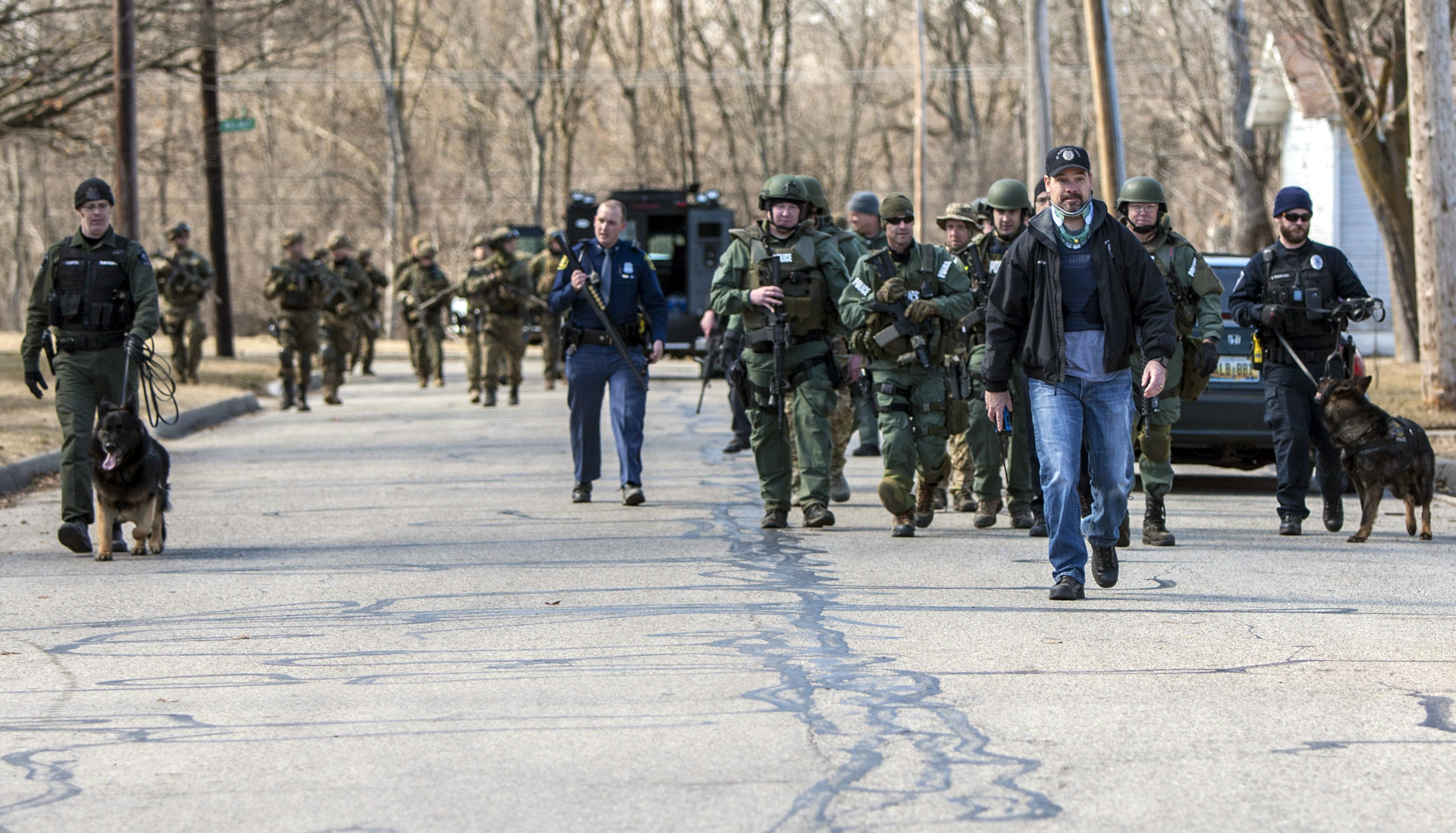 The Latest: College student arraigned in parents' slayings