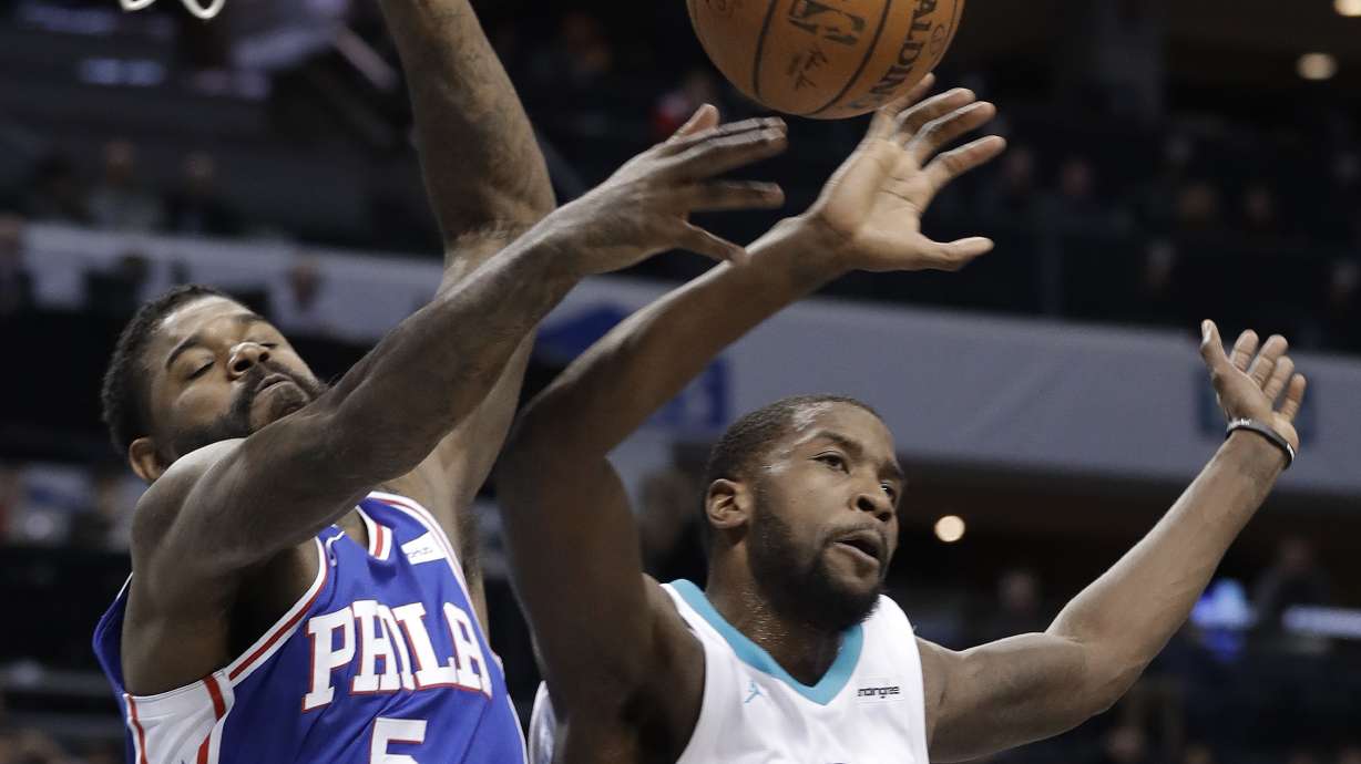 Covington, hot-shooting 76ers rout Hornets 128-114