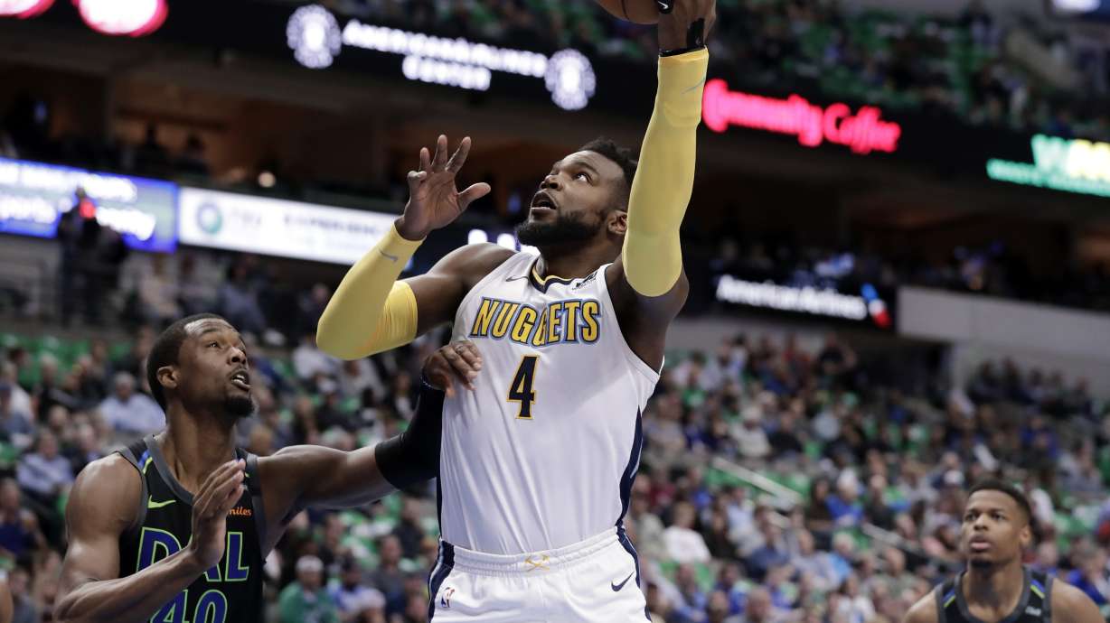 Nowitzki, Mavs hand Nuggets damaging loss in tight West race