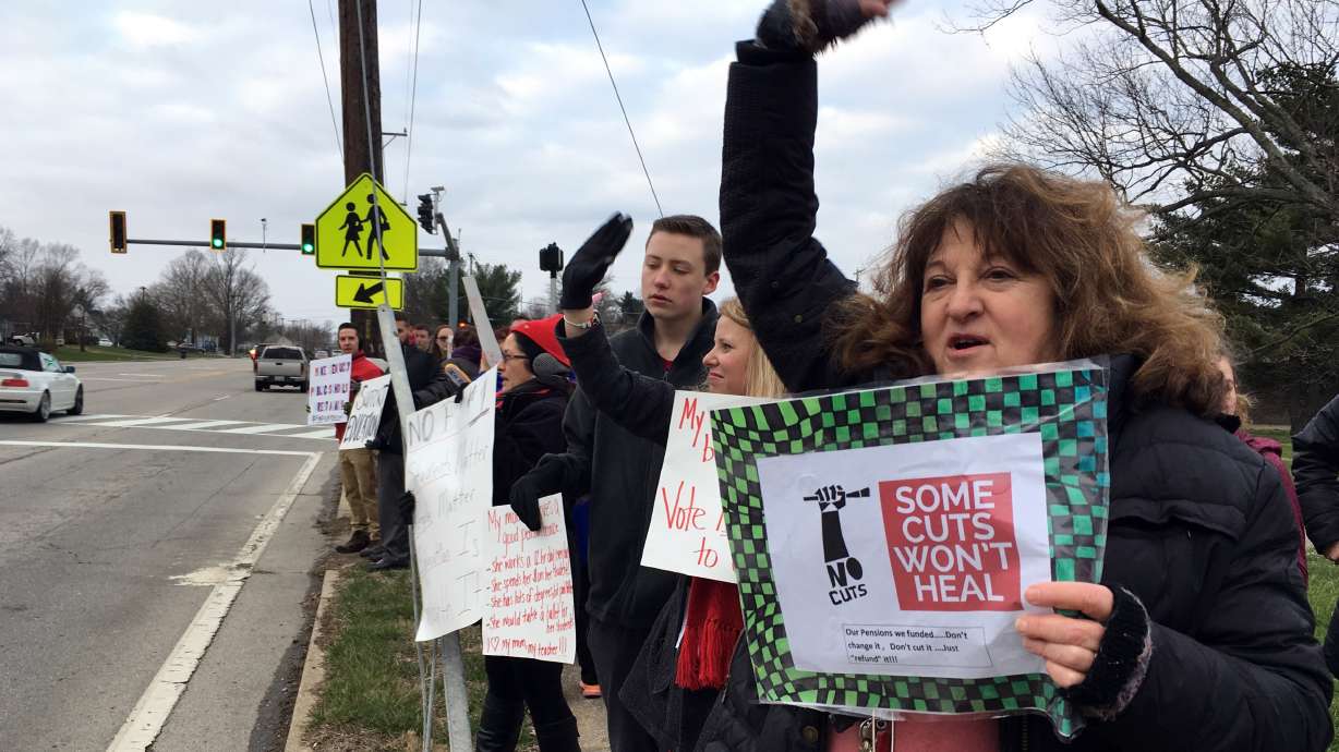 Kentucky teachers rally over retirement cuts, warn of strike