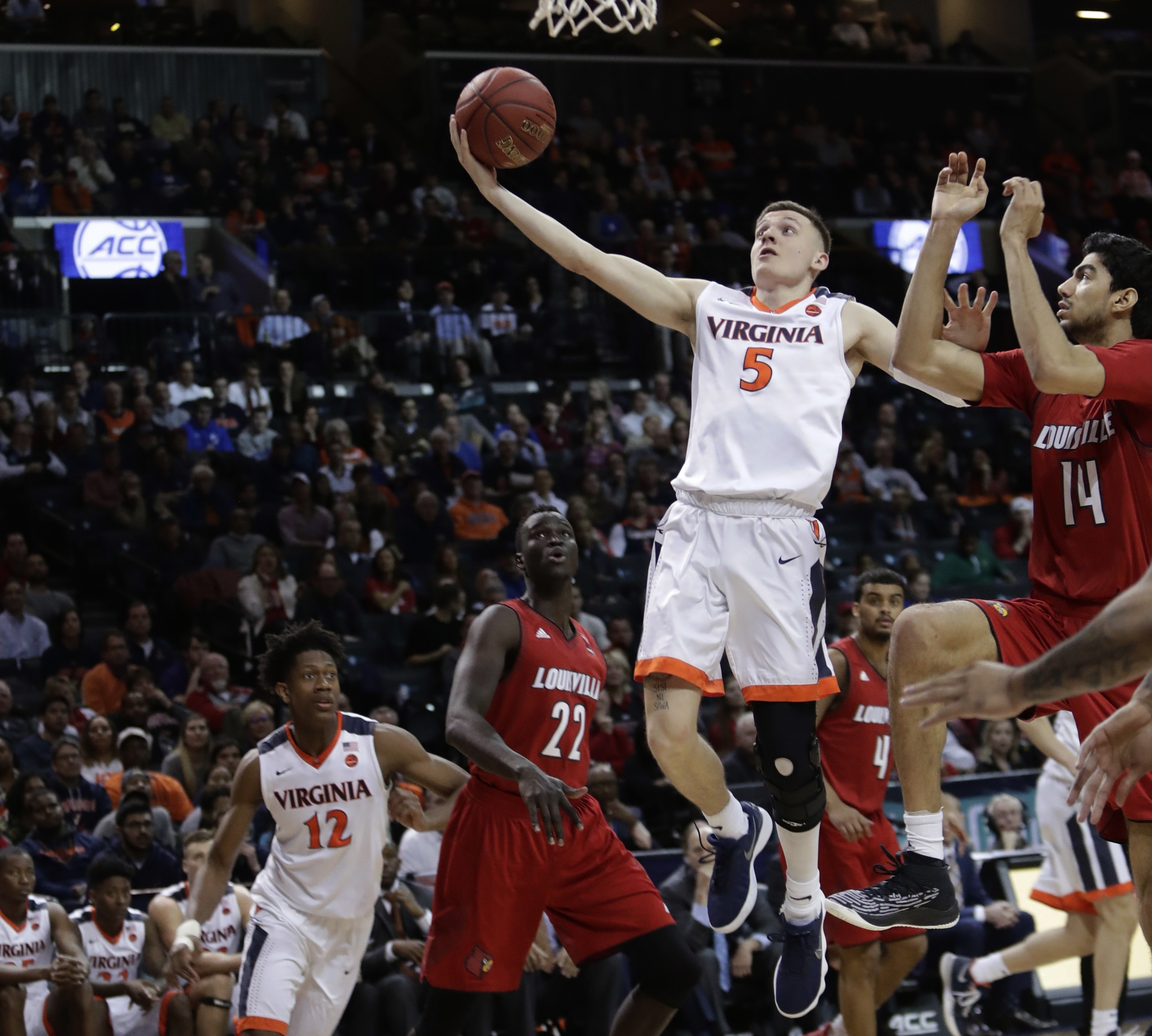 Guy scores 19, No. 1 Virginia tops Louisville in ACC tourney