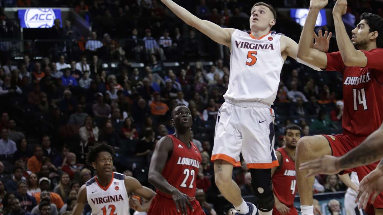 Guy scores 19, No. 1 Virginia tops Louisville in ACC tourney
