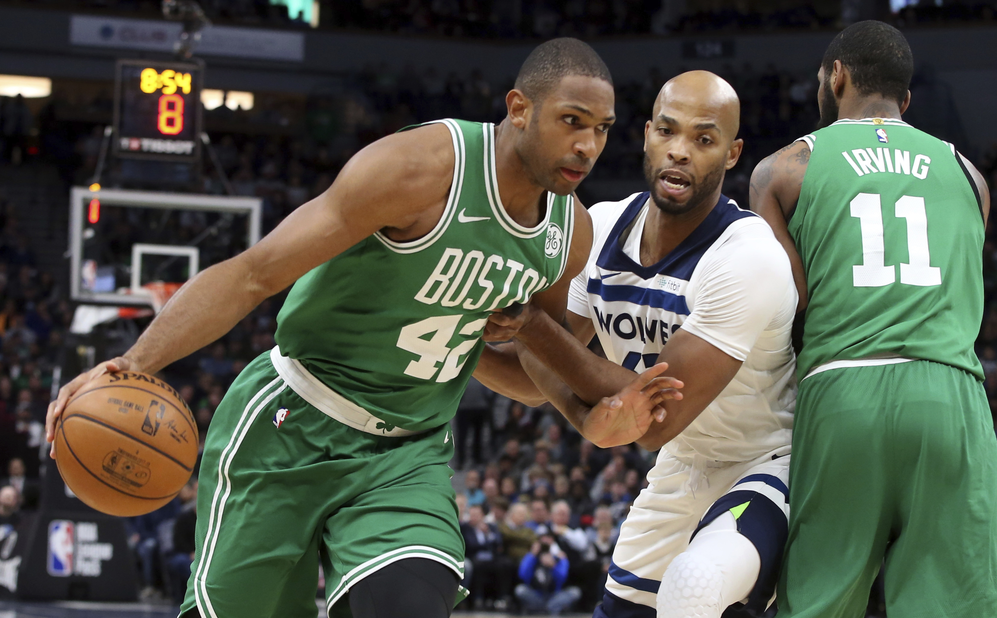 Irving returns to carry Celtics past Timberwolves 117-109