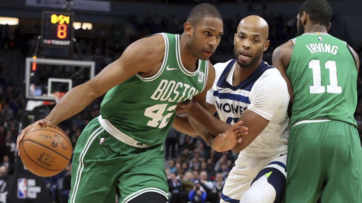 Irving returns to carry Celtics past Timberwolves 117-109