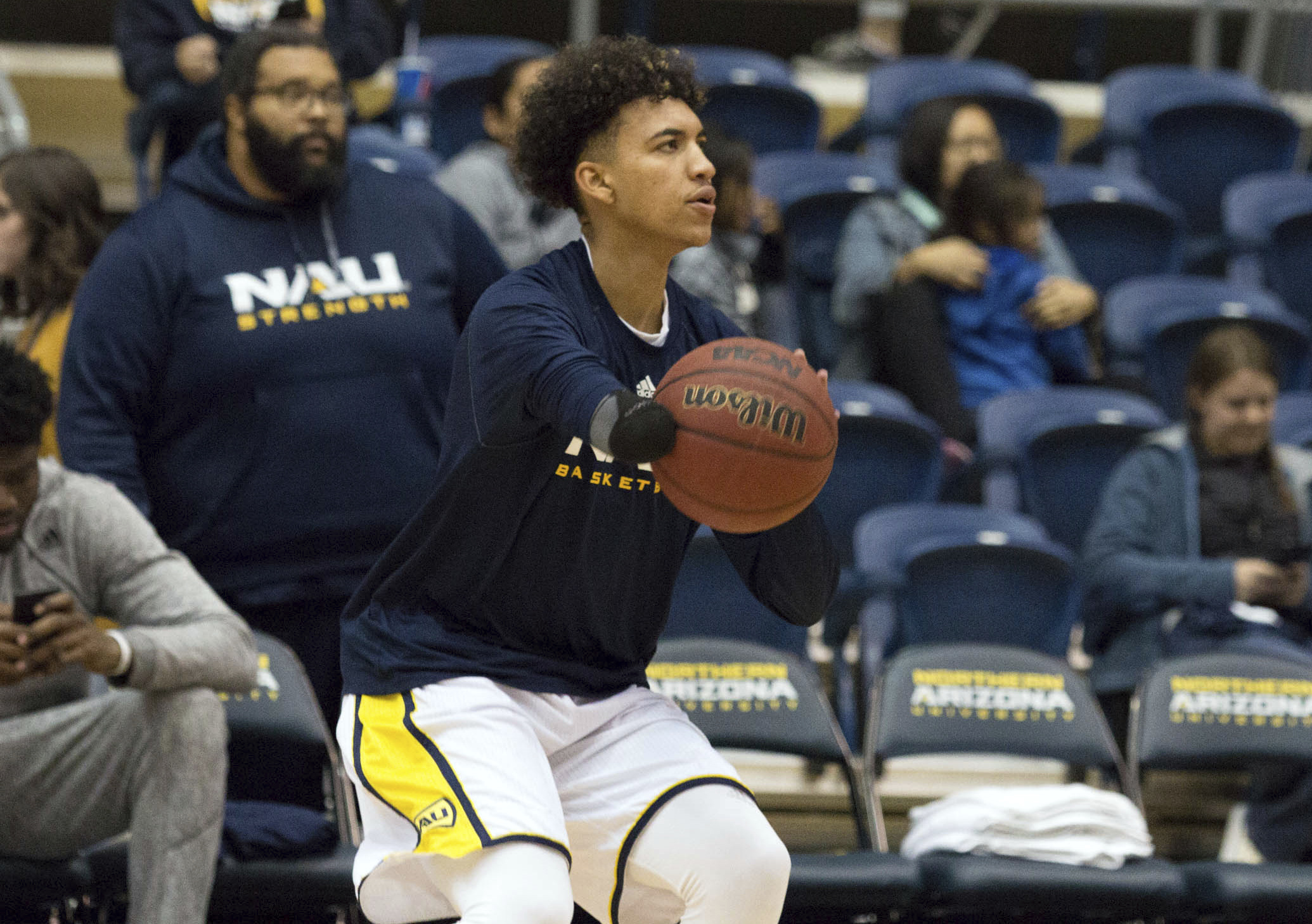 One-handed Northern Arizona player spreading inspiration