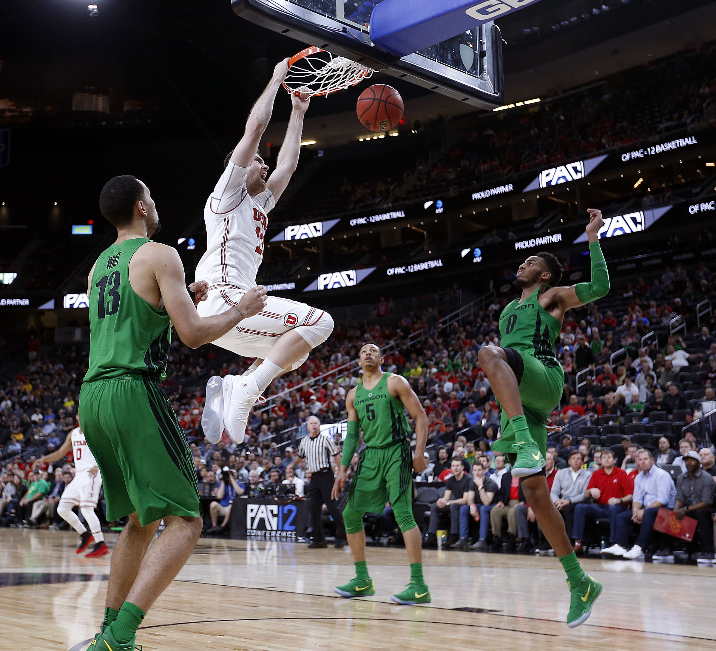 Utah forward David Collette dunks during a Pac 12 Tournament quarterfinal against Oregon at T-Mobile Arena in Las Vegas. (Photo: Ravell Call, Deseret News)
