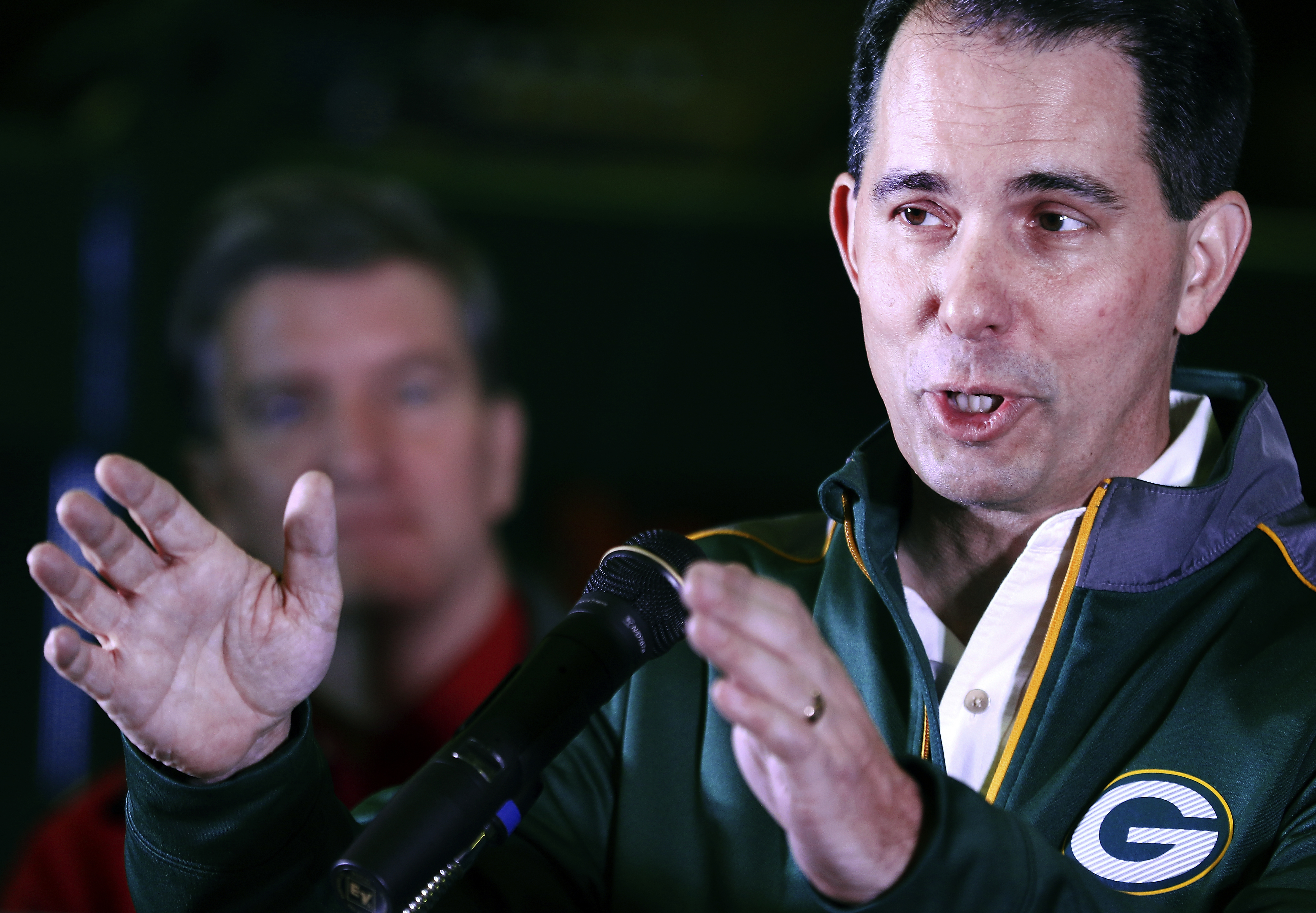 GOP crusader Walker reaches to center in volatile Wisconsin