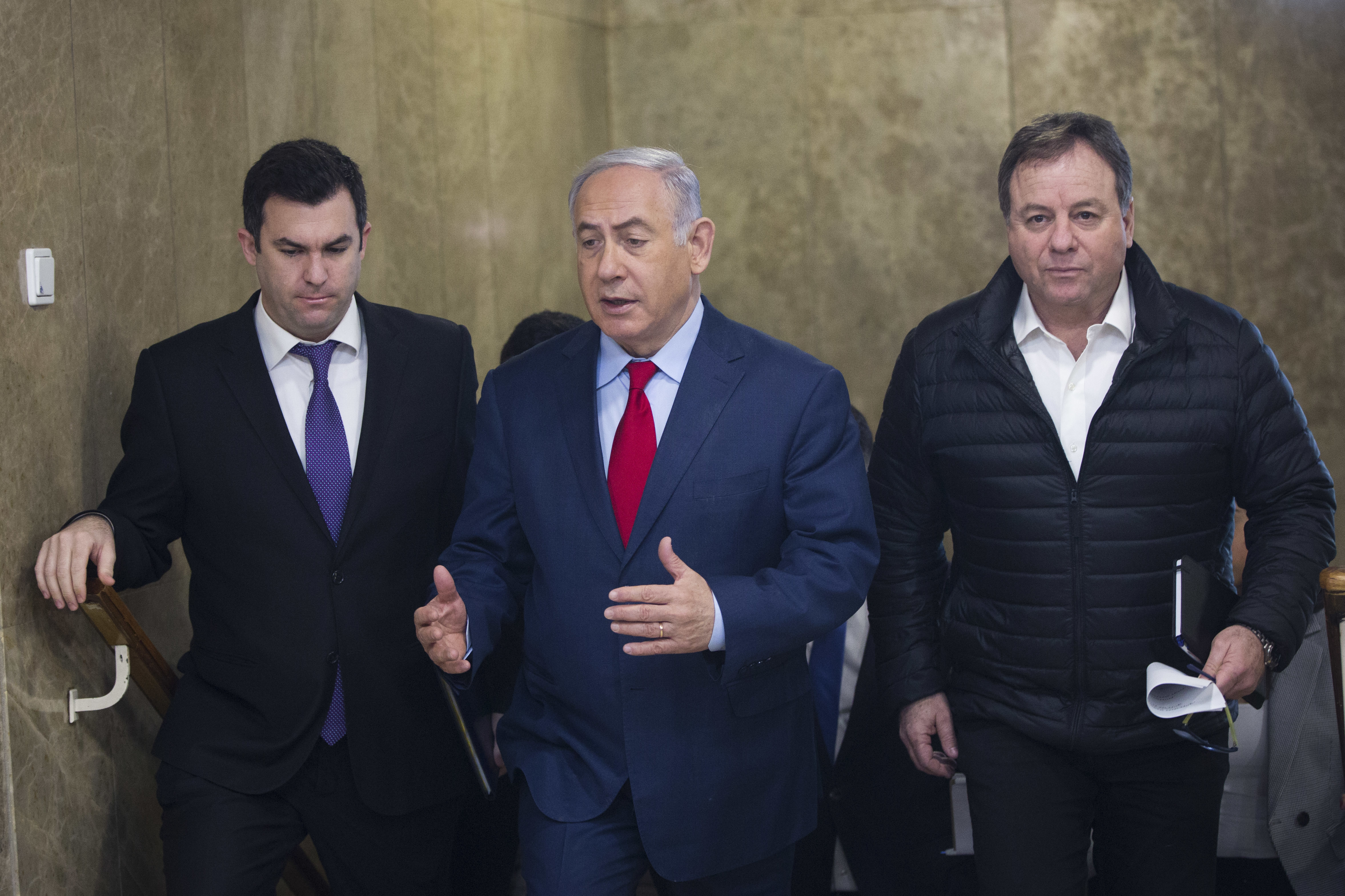 Israel's embattled PM holds off on early elections, for now